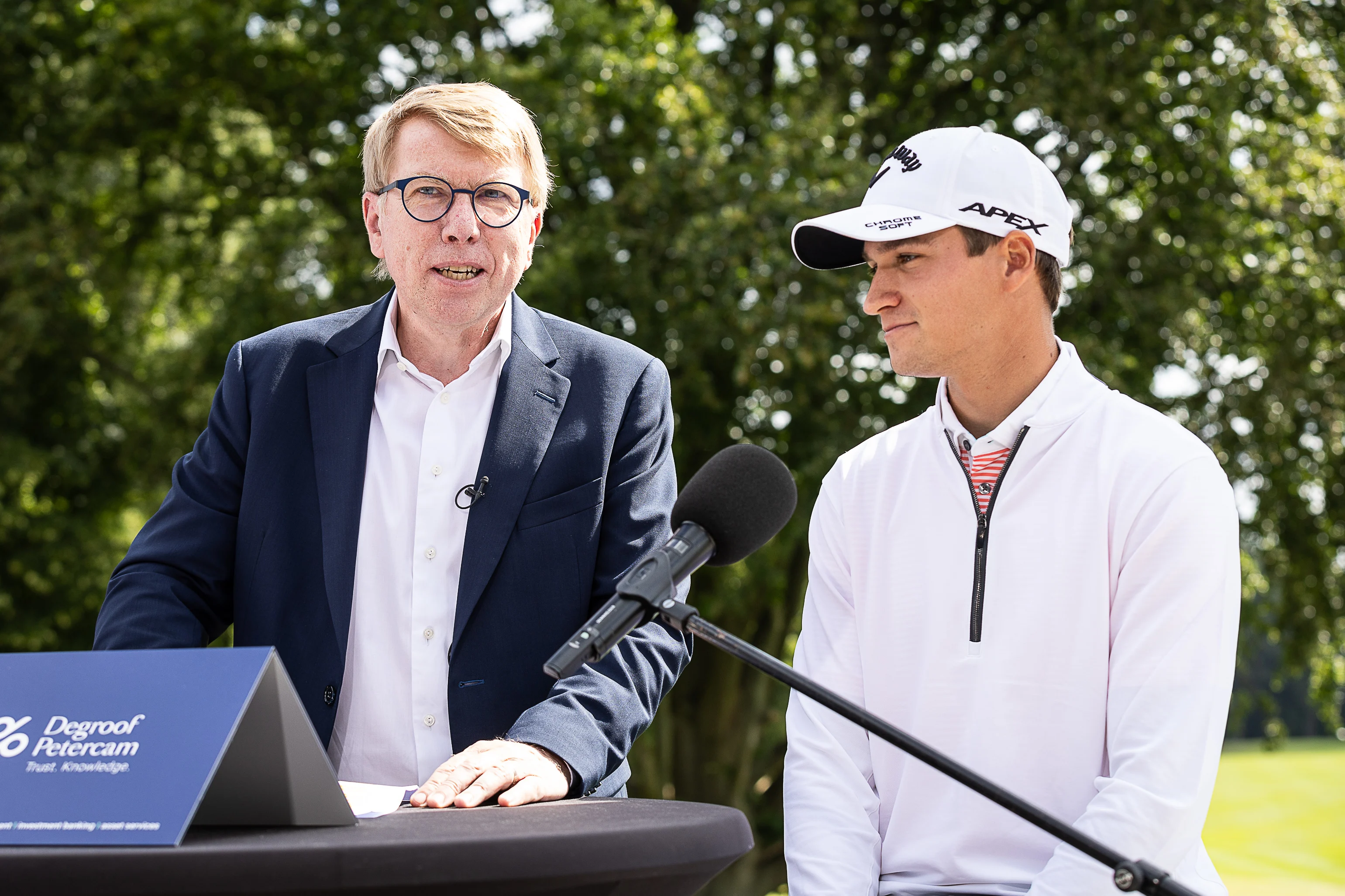 Degroof-Petercam ceo Hugo Lasat and Belgian golfer Adrien Dumont de Chassart pictured during a press moment of Belgian golfer Dumon de Chassart, at the Royal Waterloo Golf Club, in Lasne, Thursday 06 July 2023. The layer is also announcing his new cooperation with Degroof Petercam. BELGA PHOTO JAMES ARTHUR GEKIERE