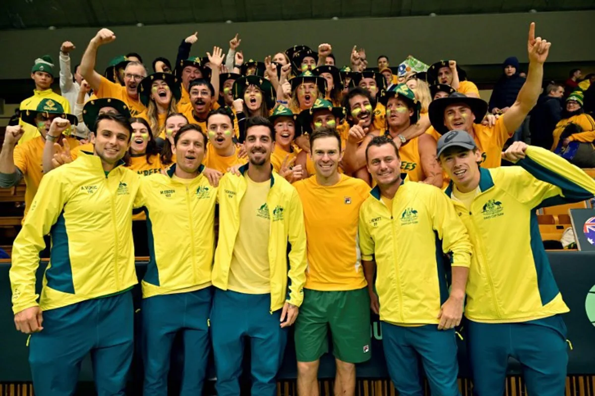 Australian team (LtoR), Aleksandar Vukic, Matthew Ebden, Thanasi Kokkinakis, John Peers, team captain Lleyton Hewitt and Alex De Minaur pose with fans after the Davis Cup tennis tournament between Sweden and Australia at the Royal Tennis Hall in Stockholm, Sweden, on February 1, 2025. Australia overall won the tournament 3-1 against Sweden. Jonas EKSTROMER / TT NEWS AGENCY / AFP