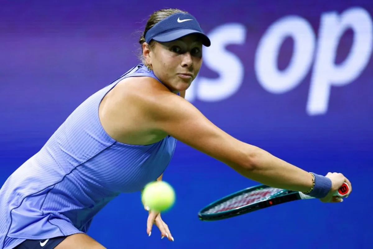 USA's Amanda Anisimova eyes the ball during her women's singles semifinal tennis match against Japan's Naomi Osaka on day twelve of the US Open tennis tournament at the USTA Billie Jean King National Tennis Center in New York City, on September 4, 2025. Kena BETANCUR / AFP