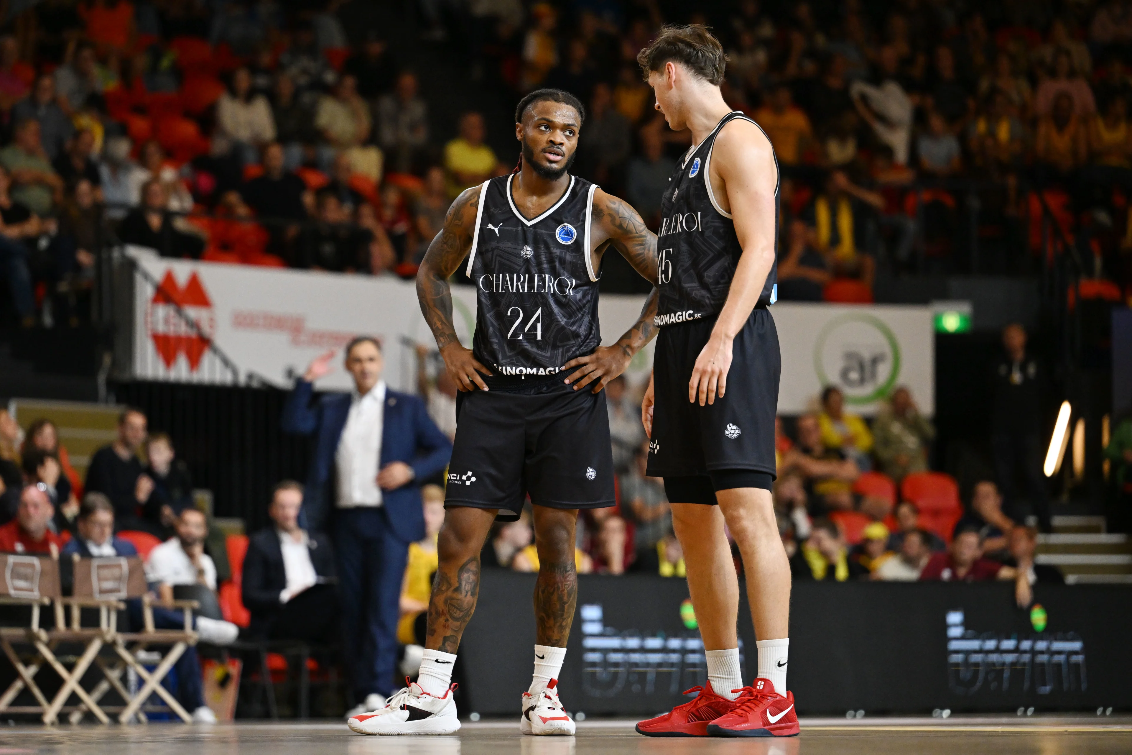 Spirou's Cobe Williams and Spirou's Sander Hollanders pictured during a basketball match between BC Oostende and Spirou Charleroi, Saturday 14 September 2024 in Oostende, on day 1 of the 'BNXT League' Belgian/ Dutch first division basket championship. BELGA PHOTO MAARTEN STRAETEMANS