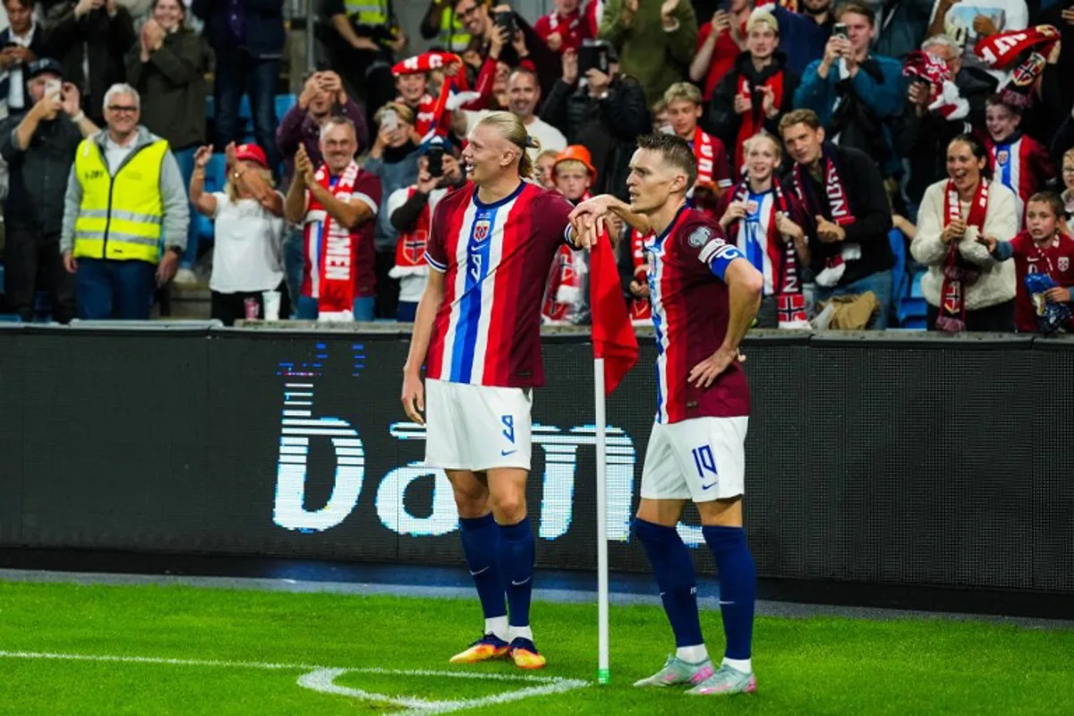 Norway's forward Erling Braut Haaland (L) and celebrates the 3-0 goal with Norway's midfielder Martin Ødegaard during the 2026 World Cup qualifiers Europe zone group I football match between Norway and Moldova on September 9, 2025 in Oslo, Norway. Fredrik Varfjell / NTB / AFP