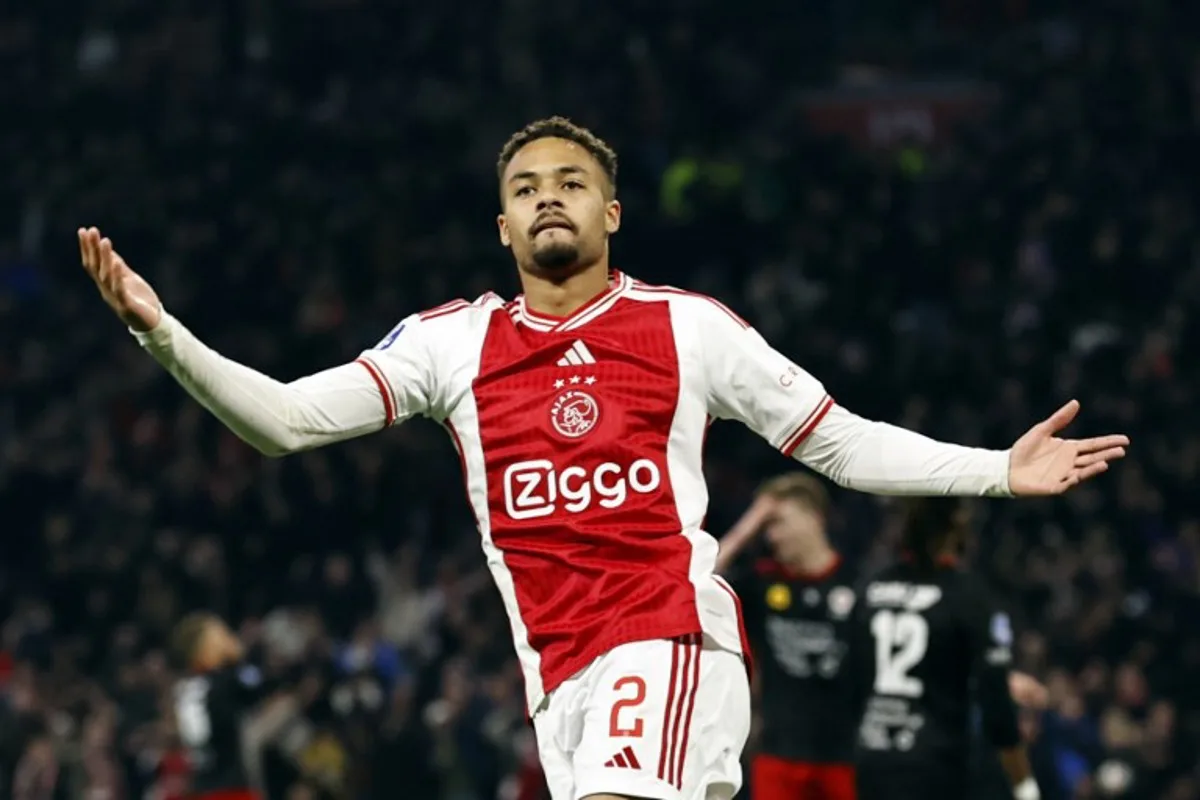 Ajax's Dutch defender #02 Devyne Rensch celebrates after scoring during the Dutch Eredivisie football match between Ajax Amsterdam and Excelsior Rotterdam at the Johan-Cruijff Arena, in Amsterdam on April 24, 2024.  MAURICE VAN STEEN / ANP / AFP