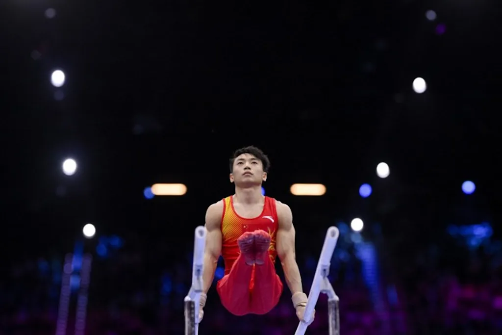 China's Jingyuan Zou competes in the Men's Parallel Bars Final during the 54th FIG Artistic Gymnastics World Championships, in Rotterdam, southern Netherlands, on October 25, 2026. JOHN THYS / AFP