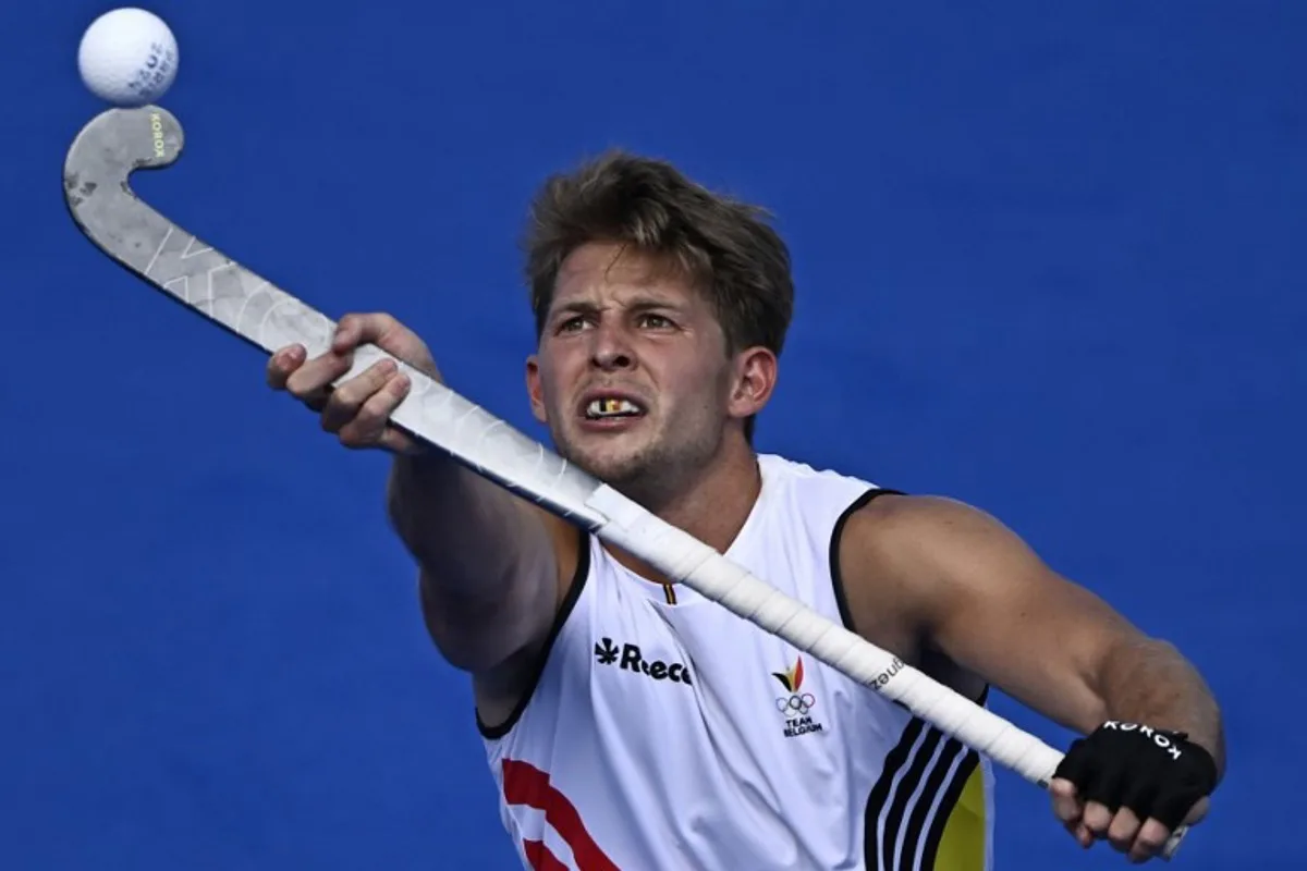 Belgium's midfielder #26 Victor Wegnez controls the ball in the men's pool B field hockey match between Belgium and New Zealand during the Paris 2024 Olympic Games at the Yves-du-Manoir Stadium in Colombes on July 28, 2024. JULIEN DE ROSA / AFP