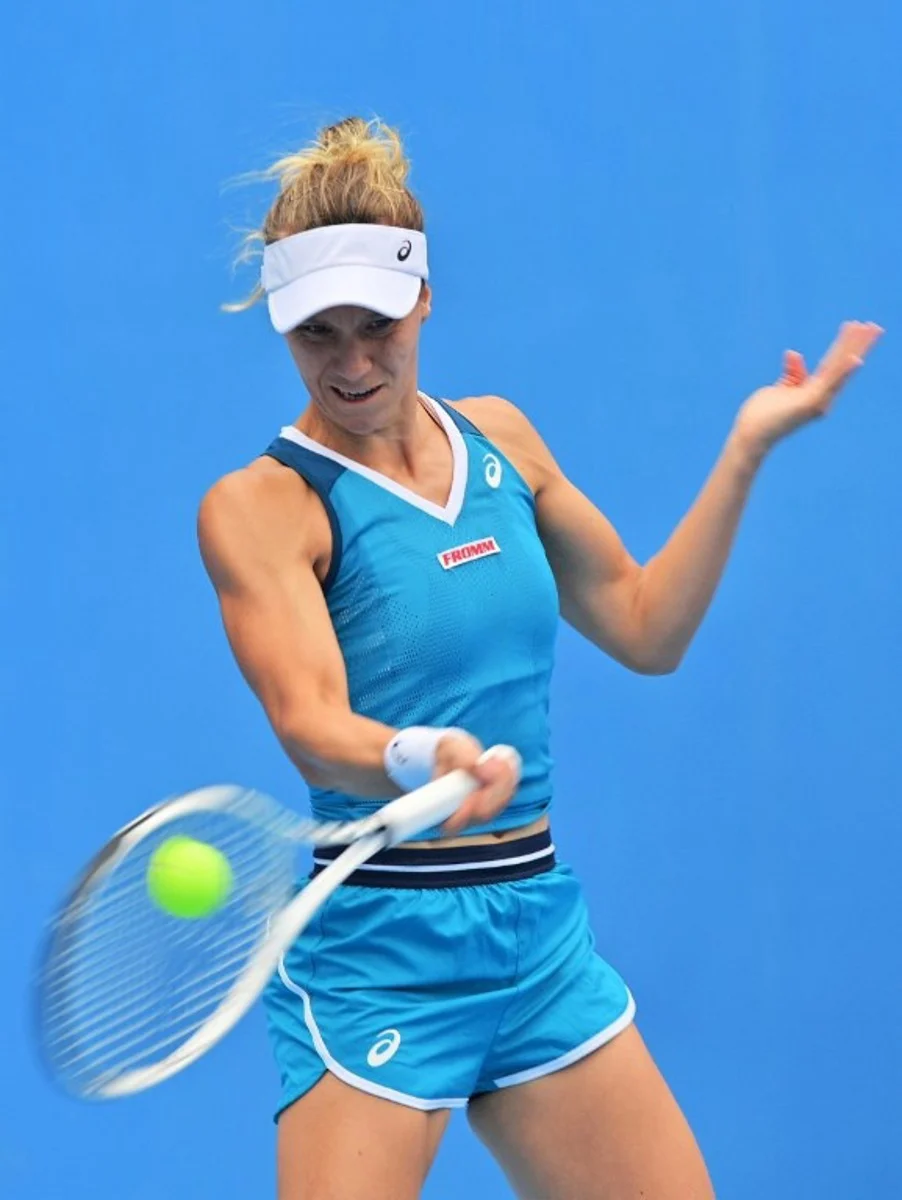 Switzerland's Viktorija Golubic hits a return to Arantxa Rus of the Netherlands during their women's singles quarter-final at the Jiangxi Open tennis tournament in Jiujiang, in China's central Jiangxi province on November 1, 2024.  AFP