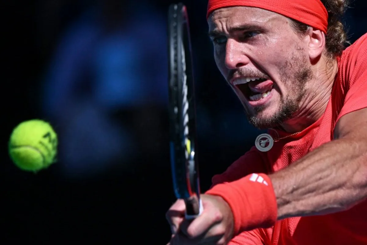 Germany's Alexander Zverev hits a return against USA's Tommy Paul during their men's singles quarterfinal match on day ten of the Australian Open tennis tournament in Melbourne on January 21, 2025.  WILLIAM WEST / AFP