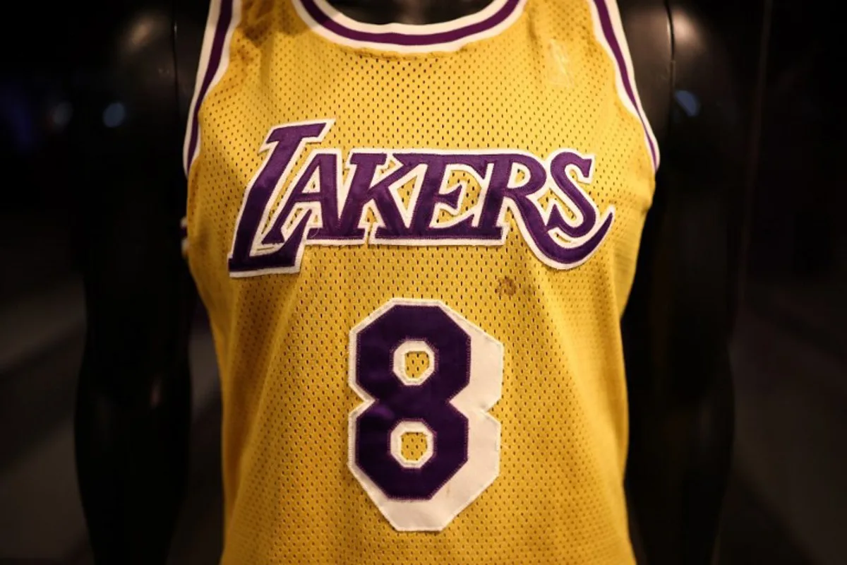 Kobe Bryant's Los Angeles Lakers game-worn jersey from his rookie debut game in November of 1996 is on display during a public exhibition at Sotheby's New York gallery on March 21, 2025. CHARLY TRIBALLEAU / AFP