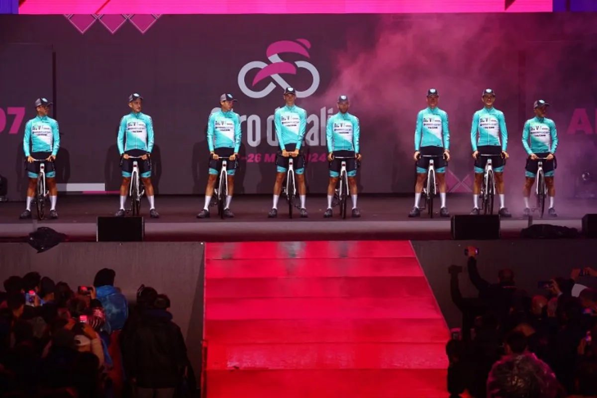 Riders of Team VF Group-Bardiani Faizane stand on stage during the opening ceremony and team presentation in Turin, on May 2, 2024, two days before the departure of the Giro d'Italia 2023 cycling race. The Giro d'Italia 2024 cycling race will depart from Venaria Reale near Turin on May 4, and finish in Rome on May 26. Luca BETTINI / AFP