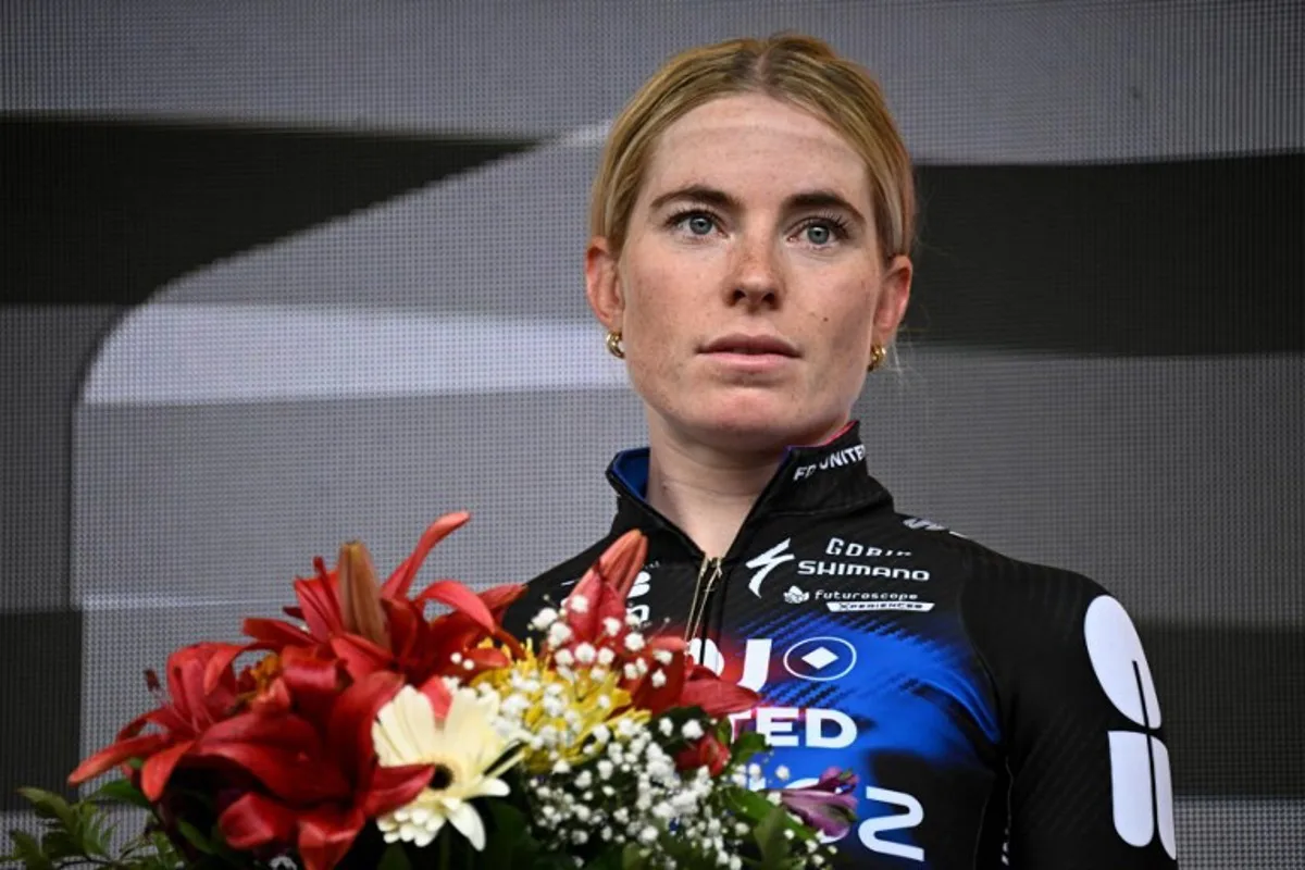 Second-placed FDJ-SUEZ team's Dutch rider Demi Vollering celebrates on the podium for the fourth edition of the Women's Tour de France cycling race at the end of the 9th and final stage (out of 9) 124.1 km from Praz-sur-Arly to Chatel, in Chatel, eastern France on August 3, 2025. JULIEN DE ROSA / AFP