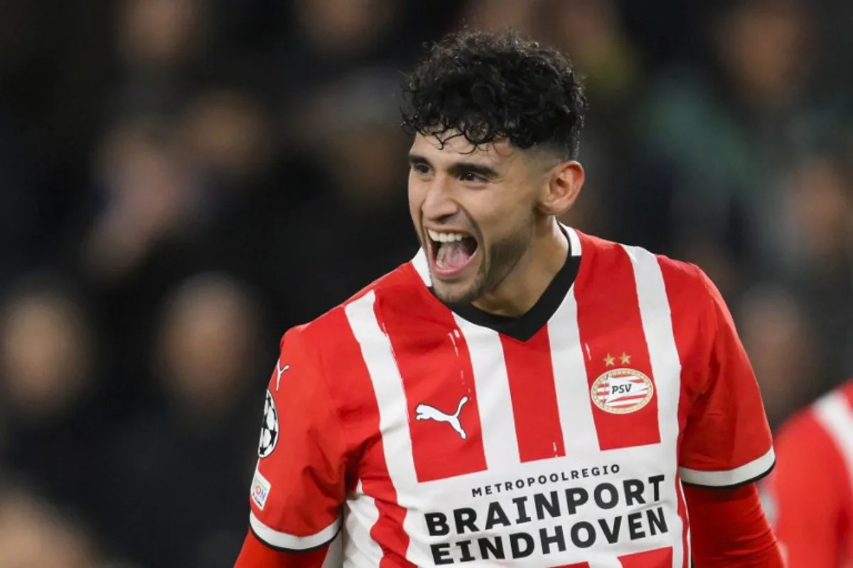 PSV Eindhoven's American forward #14 Ricardo Pepi celebrates scoring his team's third goal during the UEFA Champions League, League phase - Matchday 5, football match between PSV Eindhoven and Shakhtar Donetsk at the The Philips Stadion in Eindhoven, on November 27, 2024.  John THYS / AFP