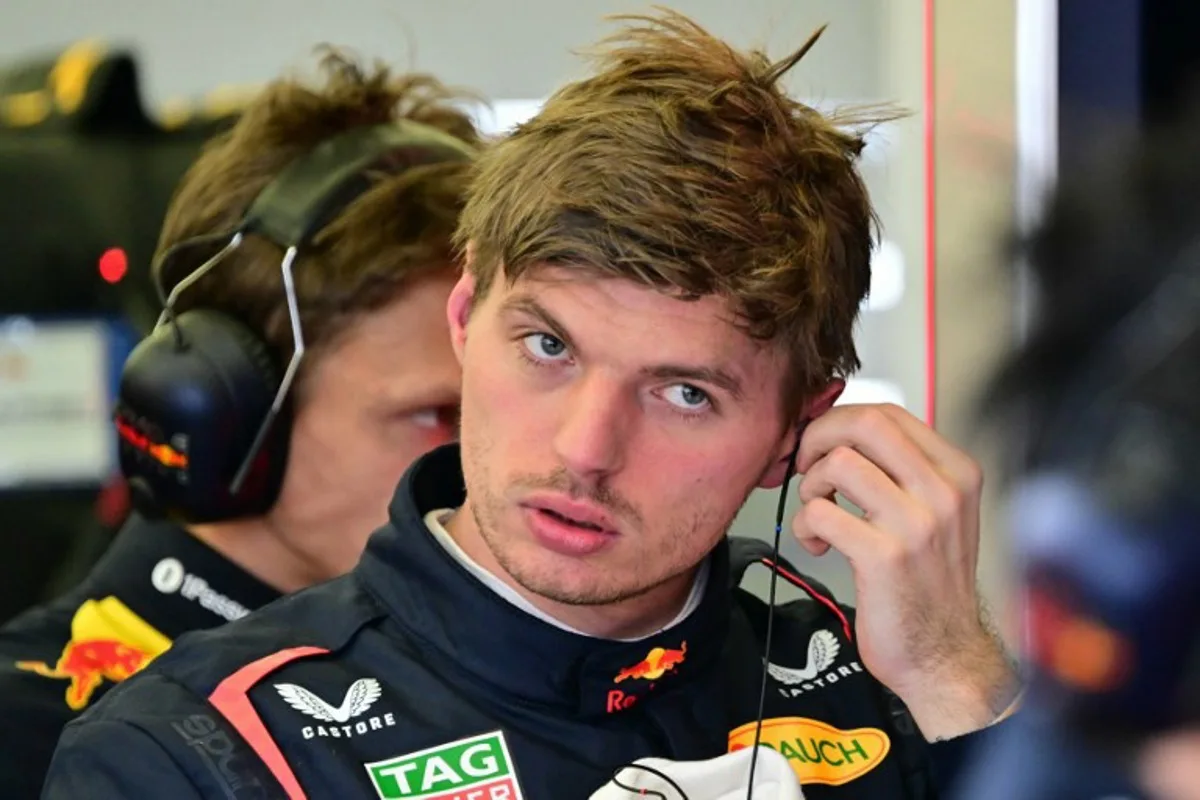 Red Bull Racing's Dutch driver Max Verstappen removes his earpiece after a lap on the third day of the Formula One pre-season testing at the Bahrain International Circuit in Sakhir on February 28, 2025.  Giuseppe CACACE / AFP