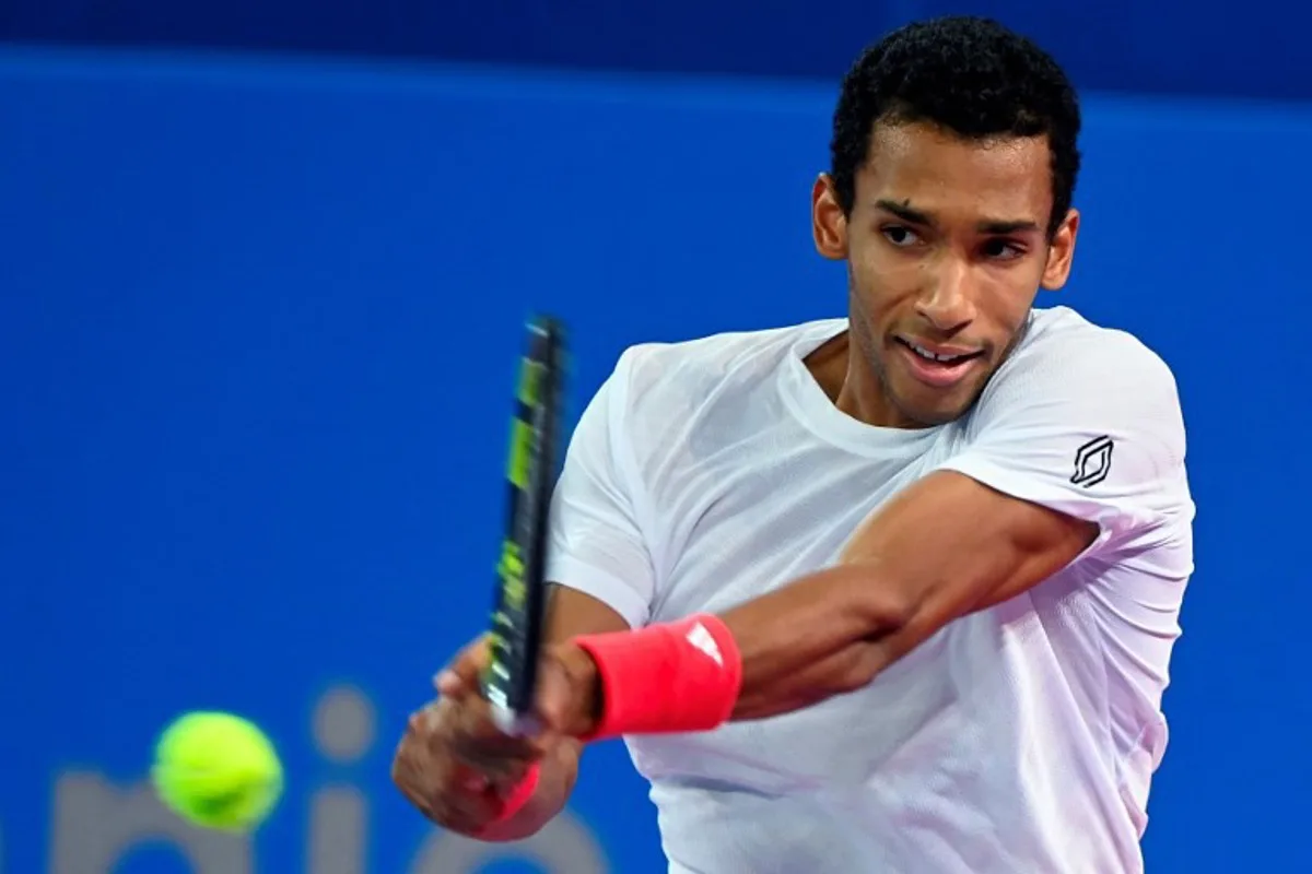 Canada's Felix Auger Aliassime returns the ball to Dutch Jesper de Jong during their men's singles semi-finals tennis match at the Open Occitanie ATP World Tour in Montpellier, southern France on February 1, 2025.  Sylvain THOMAS / AFP