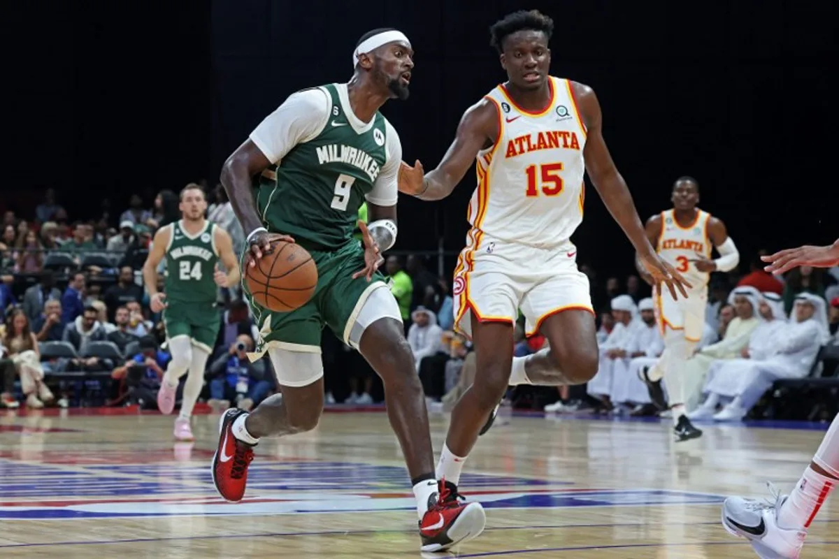 Milwaukee Bucks' forward Bobby Portis (L) is guarded by Atlanta Hawks' center Clint Capela during the NBA pre-season basketball match between the Milwaukee Bucks and the Atlanta Hawks at the Etihad Arena on Yas Island in Abu Dhabi, on October 8, 2022.  Giuseppe CACACE / AFP