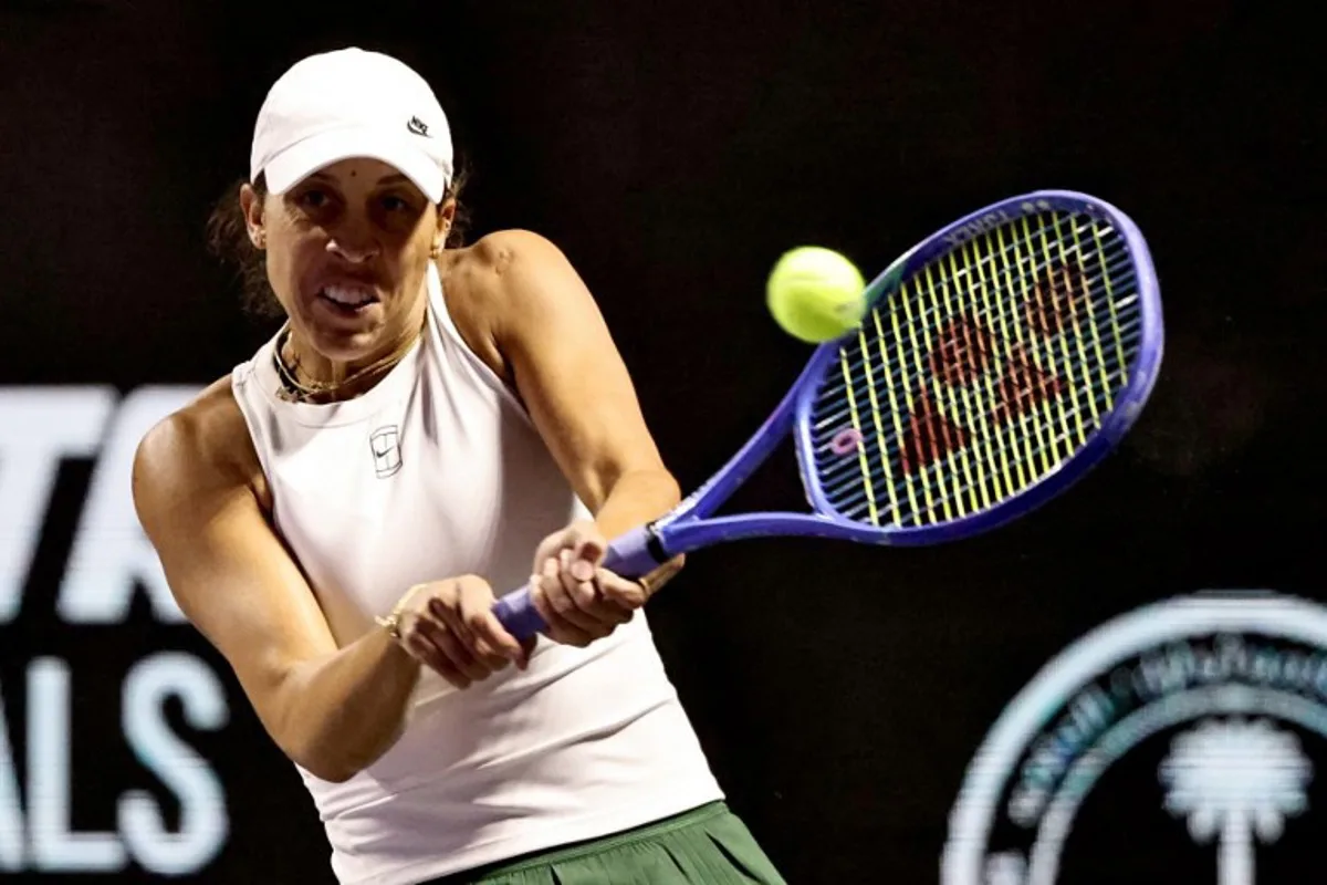 US' Madison Keys returns the ball to US' Amanda Anisimova during their tennis match at the WTA Finals in Riyadh on November 3, 2025. Fayez NURELDINE / AFP