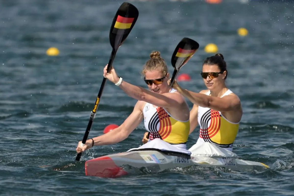Belgium's Hermien Peters (L) and Belgium's Lize Broekx compete in the women's kayak double 500m semifinal of the canoe sprint competition at Vaires-sur-Marne Nautical Stadium in Vaires-sur-Marne during the Paris 2024 Olympic Games on August 9, 2024. Bertrand GUAY / AFP