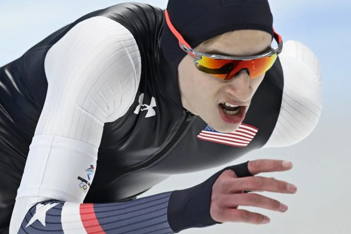 USA's Jordan Stolz competes in the men's speed skating 1000m event during the Beijing 2022 Winter Olympic Games at the National Speed Skating Oval in Beijing on February 18, 2022.  WANG Zhao / AFP