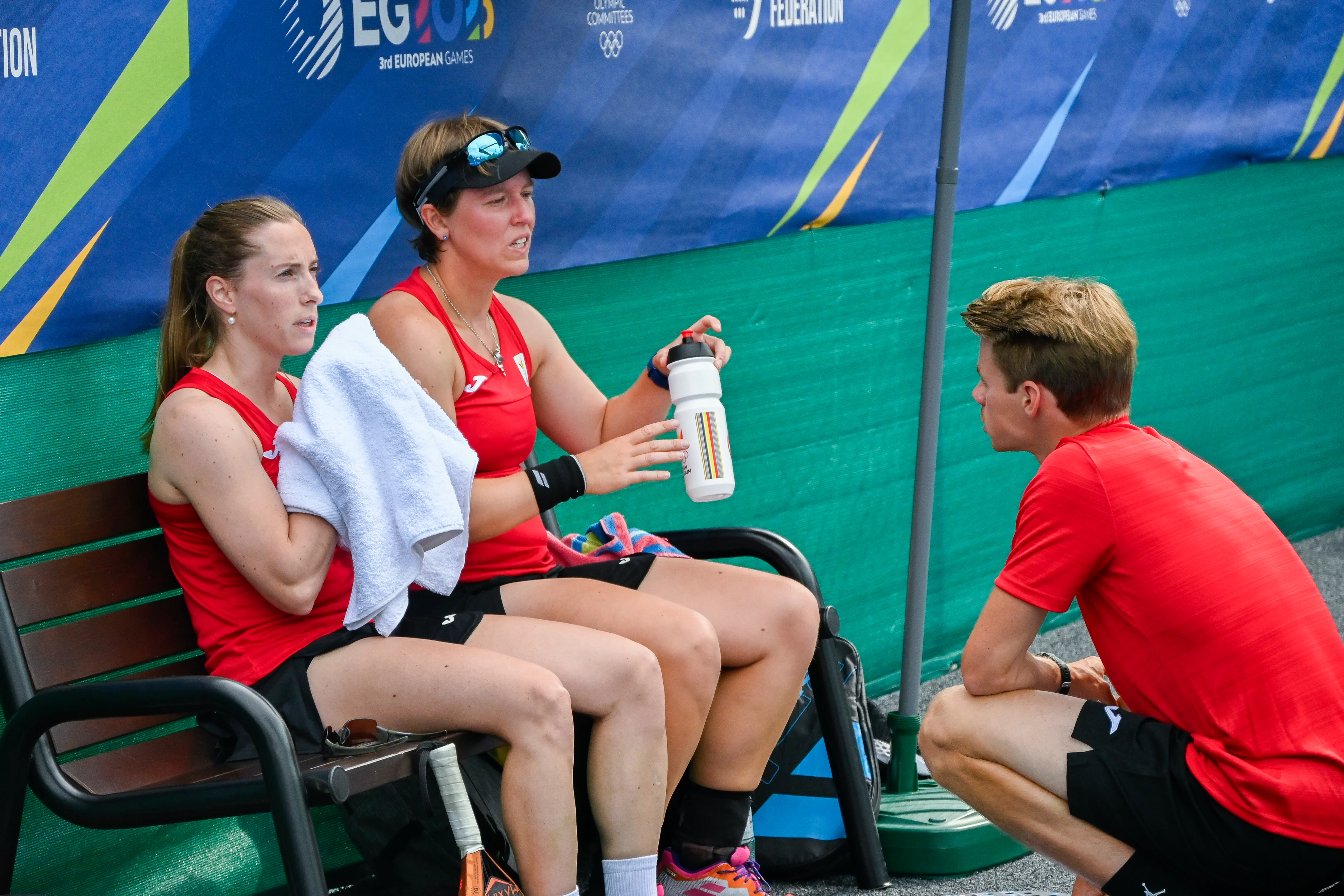 Padel player Helena Wyckaert, Padel player An-Sophie Mestach and Padel Coach Thomas Deschamps pictured during a women doubles first round game in the padel competition between Belgian pair Wyckaert-Mestach and German pair Clement-Scholten at the European Games, in Krakow, Poland, Wednesday 21 June 2023. The 3rd European Games, informally known as Krakow-Malopolska 2023, is a scheduled international sporting event that will be held from 21 June to 02 July 2023 in Krakow and Malopolska, Poland. BELGA PHOTO LAURIE DIEFFEMBACQ