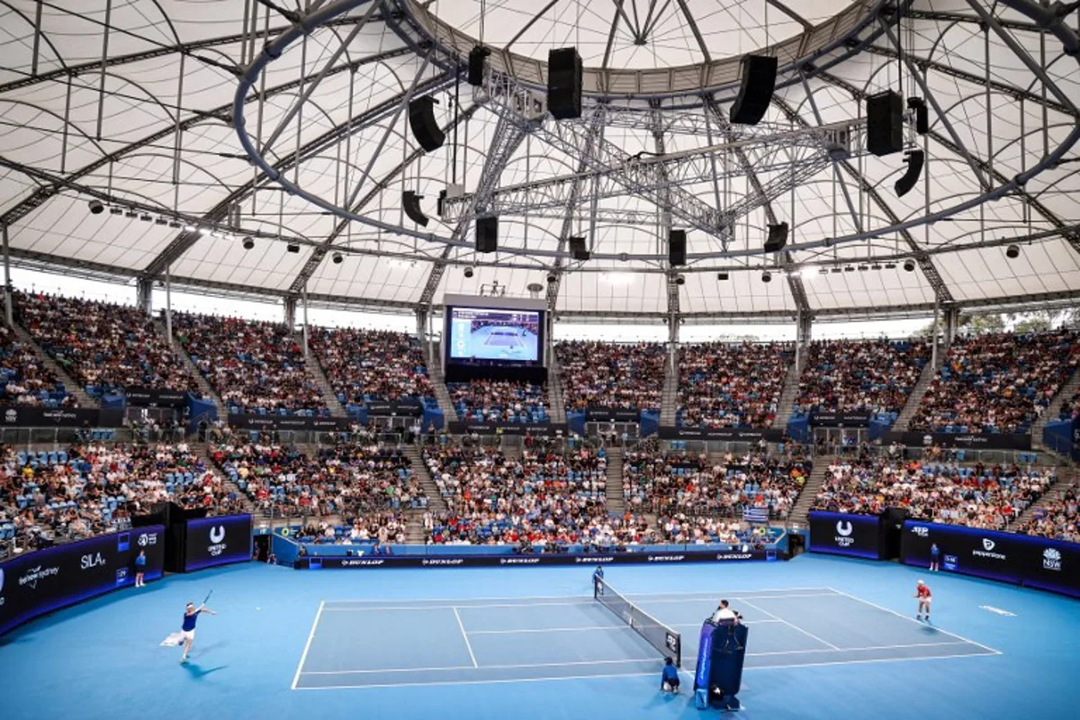 Greece's Stefanos Tsitsipas (L) hits a return against Canada's Steven Diez during their men's singles match at the United Cup tennis tournament on Ken Rosewall Arena in Sydney on January 3, 2024.  DAVID GRAY / AFP