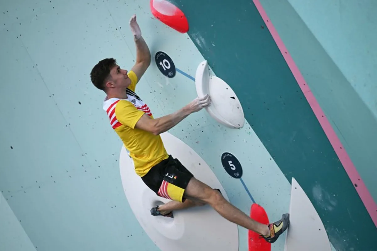 Belgium's Hannes Van Duysen competes in the men's sport climbing boulder semi final during the Paris 2024 Olympic Games at Le Bourget Sport Climbing Venue in Le Bourget on August 5, 2024. Fabrice COFFRINI / AFP
