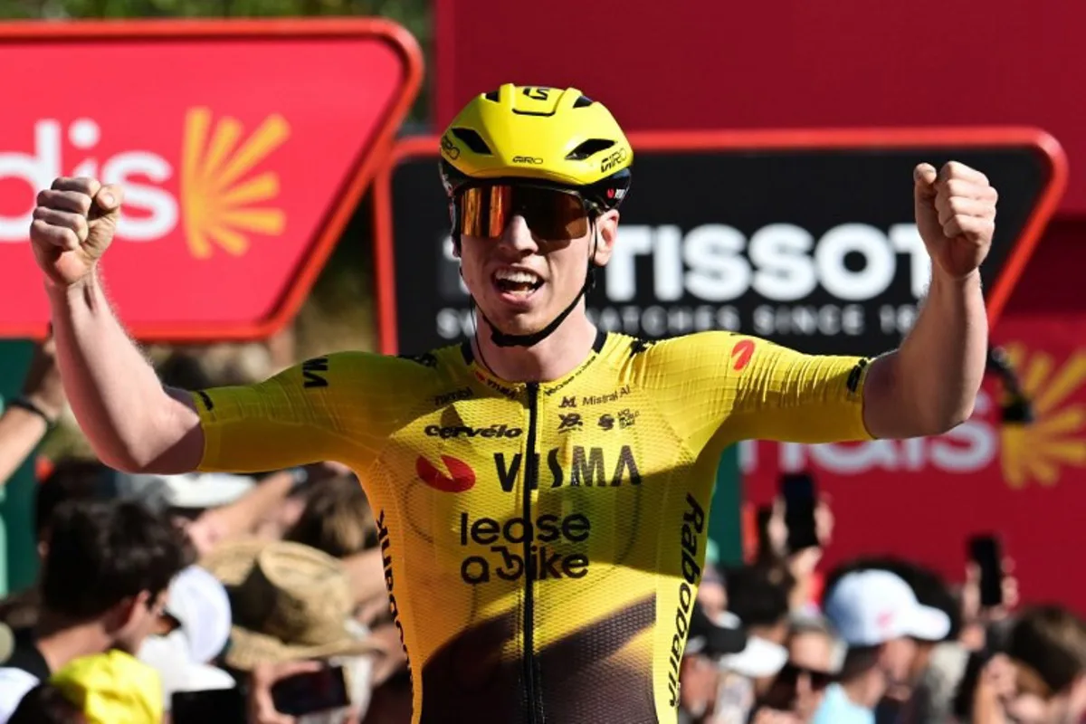 Team Visma-Lease a bike's British rider Matthew Brennan celebrates winning the second stage of the Vuelta a Espana 2026, a 214.3 km race between Monaco and Manosque on August 23, 2026. Miguel MEDINA / AFP