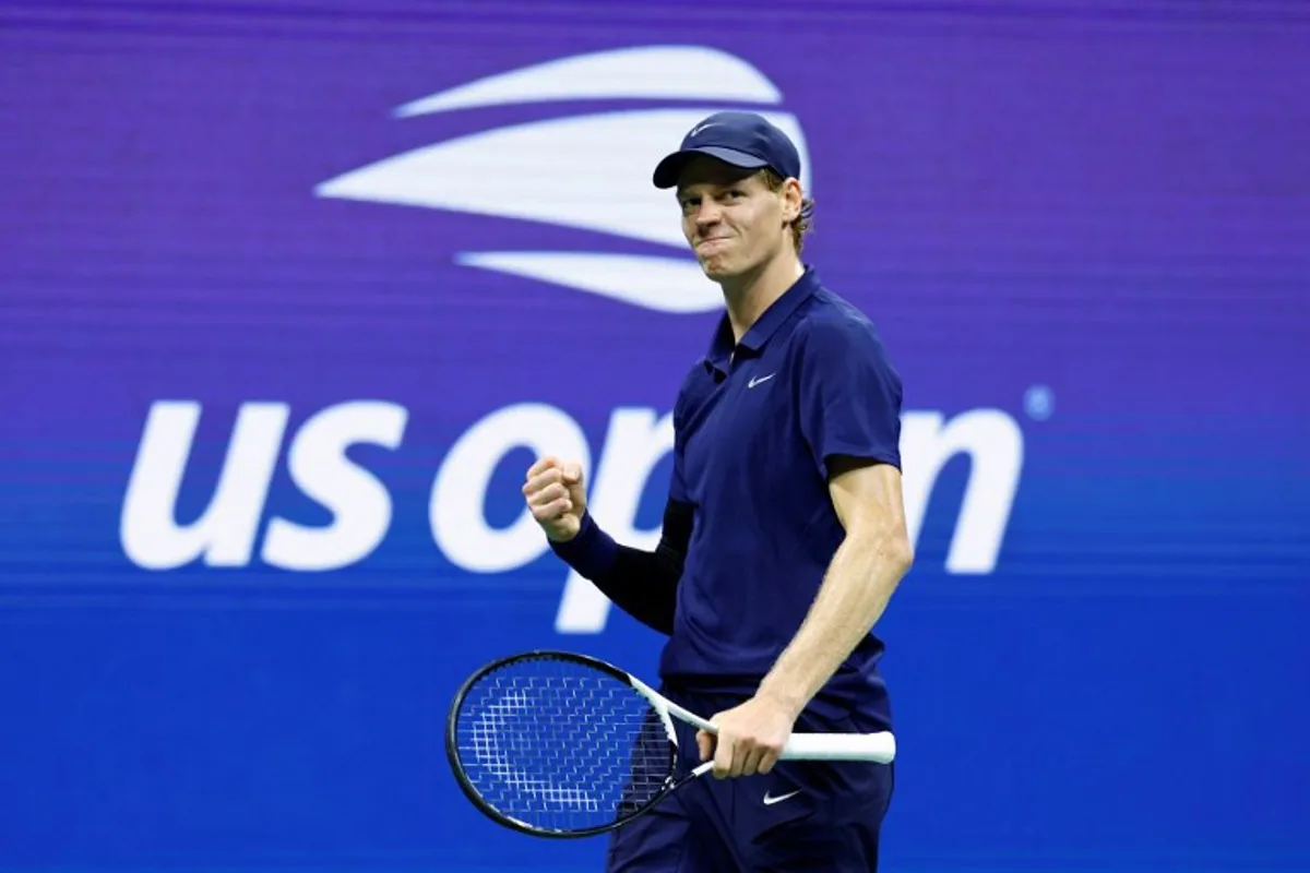 Italy's Jannik Sinner celebrates during his men's singles semifinal tennis match against Canada's Felix Auger-Aliassime on day thirteen of the US Open tennis tournament at the USTA Billie Jean King National Tennis Center in New York City, on September 5, 2025. KENA BETANCUR / AFP