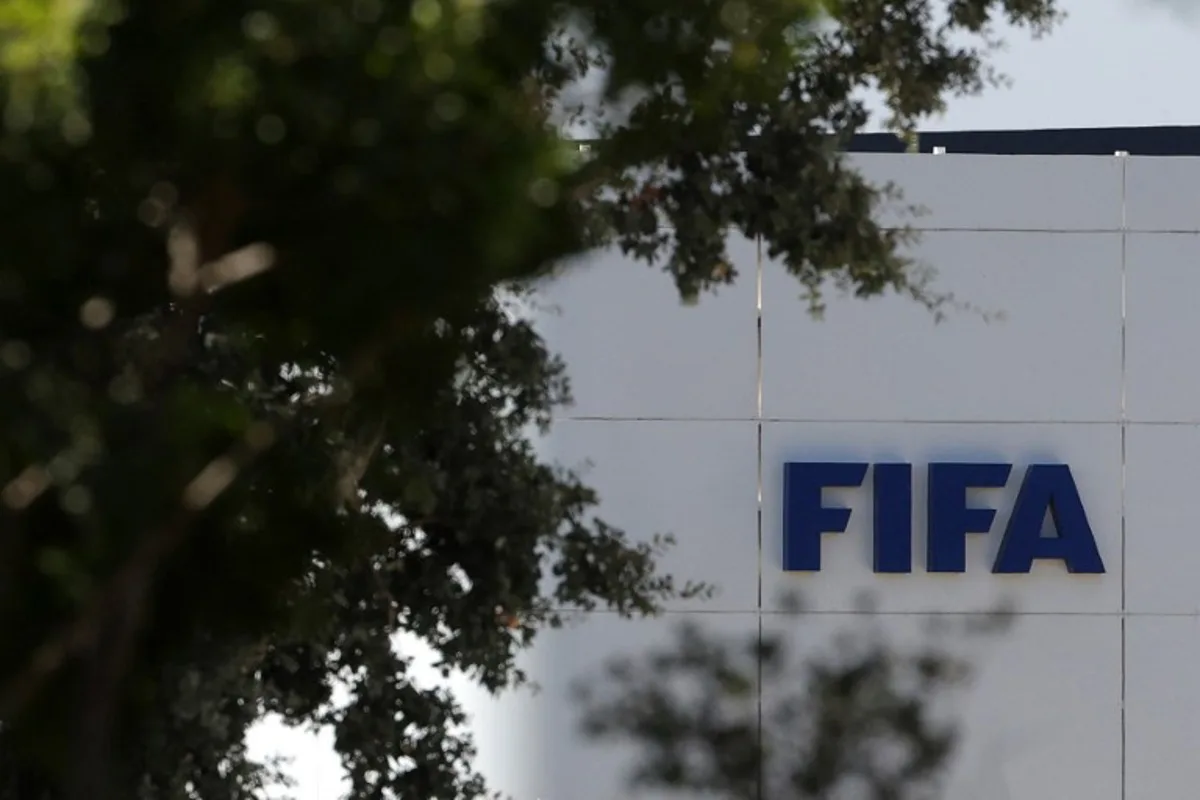 The FIFA logo is seen at its Africa regional office in Sale on August 5, 2026. President Gianni Infantino held emergency talks with other FIFA directors in Morocco on August 5, a source told AFP, amid a wave of criticism over his now shelved plan to open the World Cup to private investment. Abdelmajid BZIOUAT / AFP