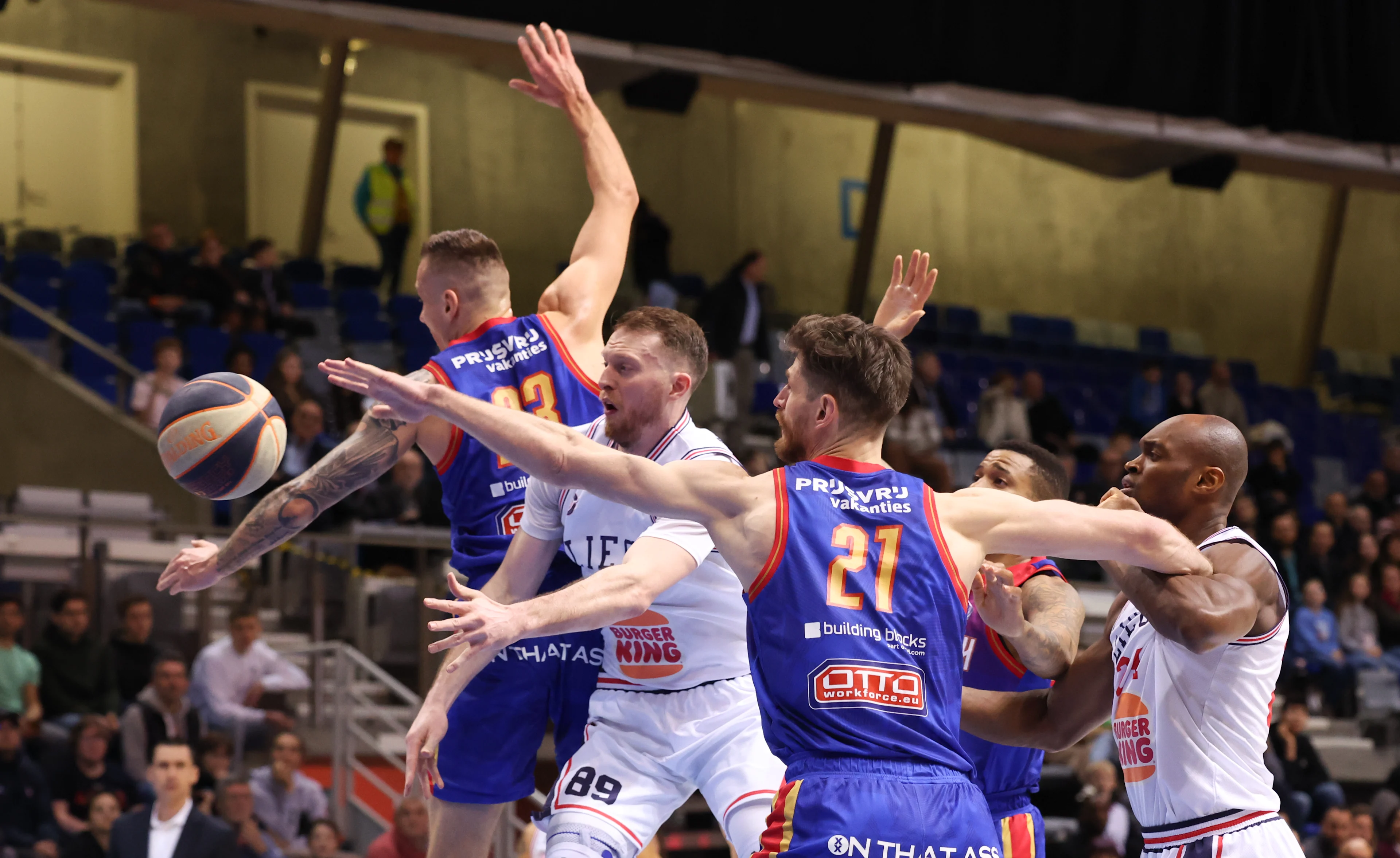 Heroes' Roberts Stumbris and Liege's Olivier Troisfontaines fight for the ball during a basketball match between Belgian club RSW Liege Basket and Dutch Heroes Den Bosch, Friday 05 April 2024 in Liege, on day 6 in the elite Gold, cross-boarder phase of the 'BNXT League' Belgian and Netherlands first division basket championship. BELGA PHOTO VIRGINIE LEFOUR