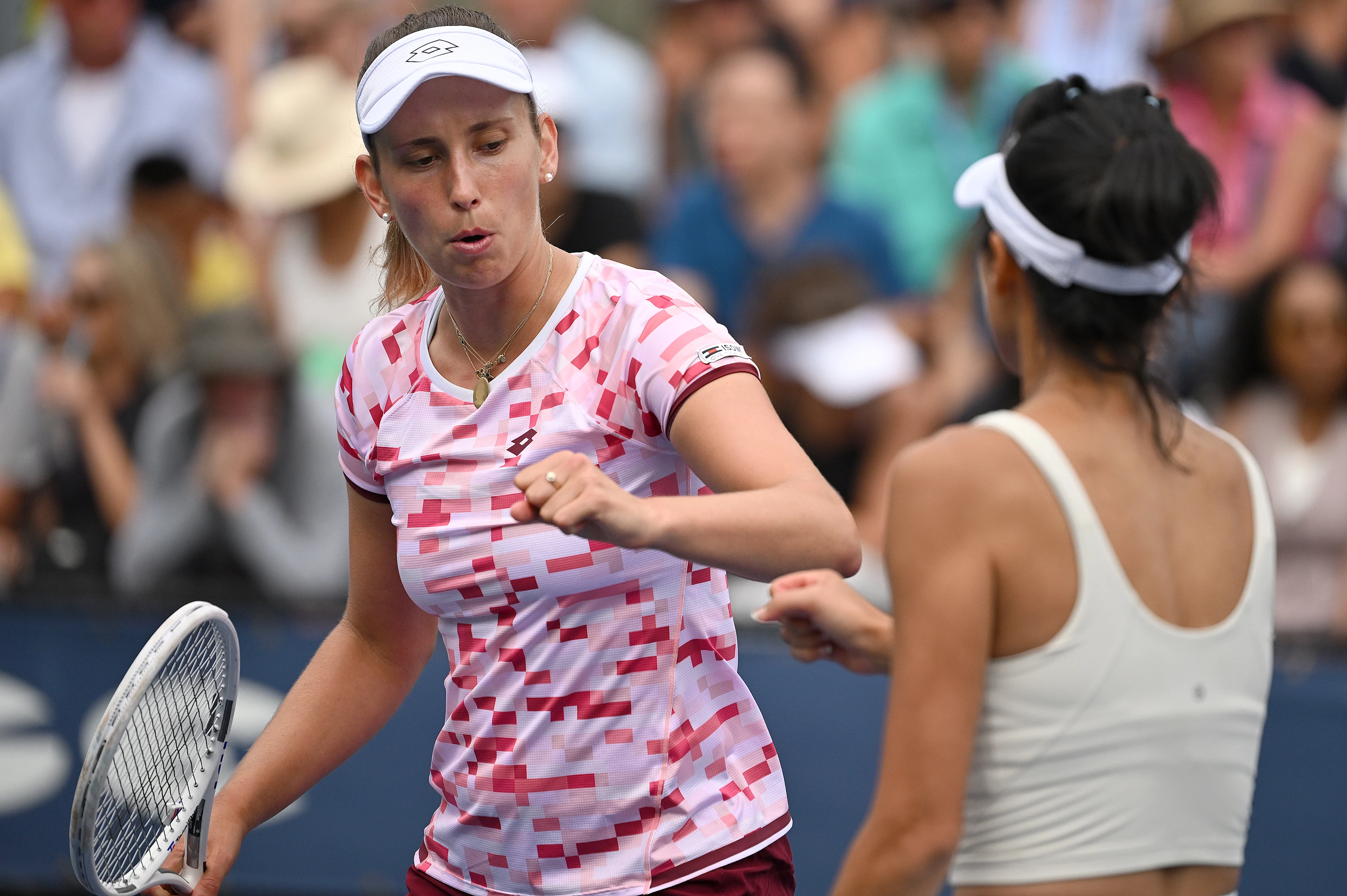 Elise Mertens of Belgium (pink) and Su-Wei Hsieh of Taipei play against Kristina Mladenovic of France and Shuai Zhang of China in the Women's Doubles: Round 1 at the 2024 U.S. Open tennis tournament at USTA Billie Jean King National Tennis Center, New York, NY, August 29, 2024. (Photo by Anthony Behar/Sipa USA)