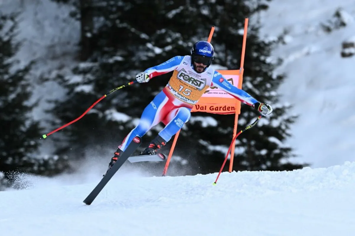 France's Cyprien Sarrazin competes in the Men's Downhill race as part of the FIS Alpine ski World Cup 2024-2025, in Val Gardena on December 21, 2024.  Marco BERTORELLO / AFP