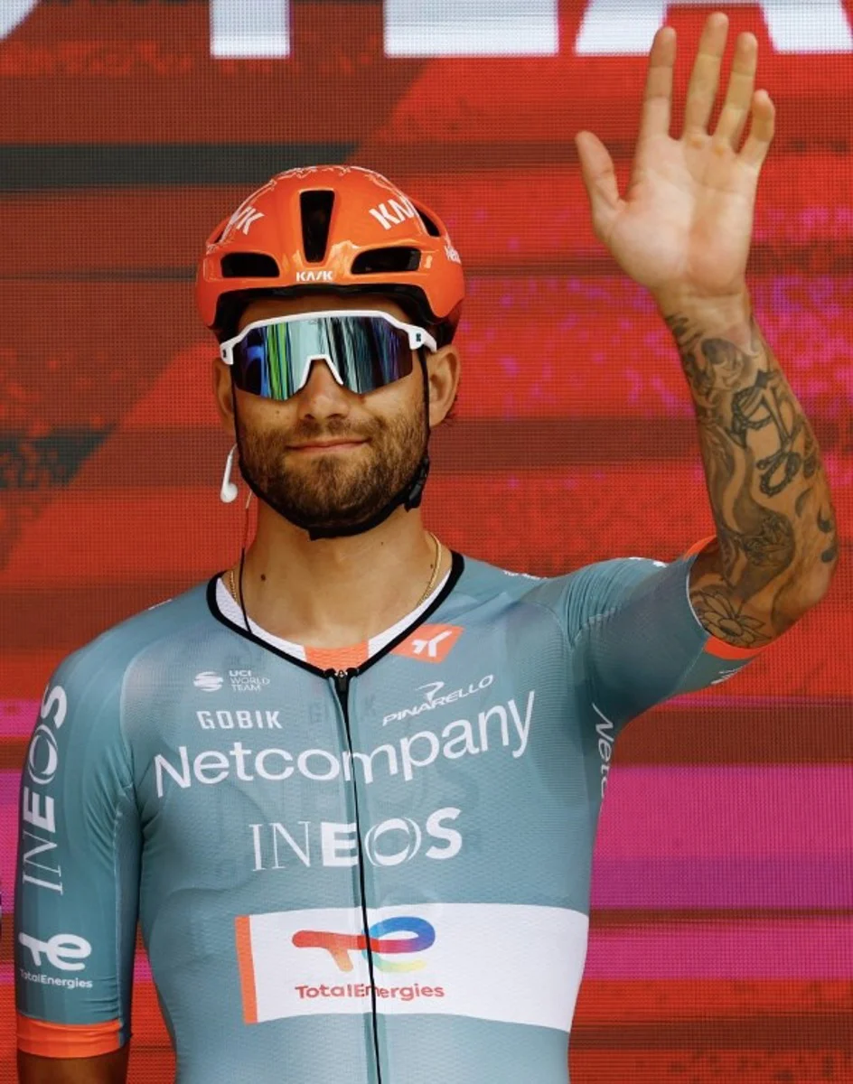 INEOS Grenadiers Italian rider Filippo Ganna waves during the presentation of the teams prior the start of the 2nd stage of the Giro d'Italia 2026 - Tour of Italy cycling race between Burgas and Veliko Tarnovo, Bulgaria, on May 9, 2026.  Luca Bettini / AFP
