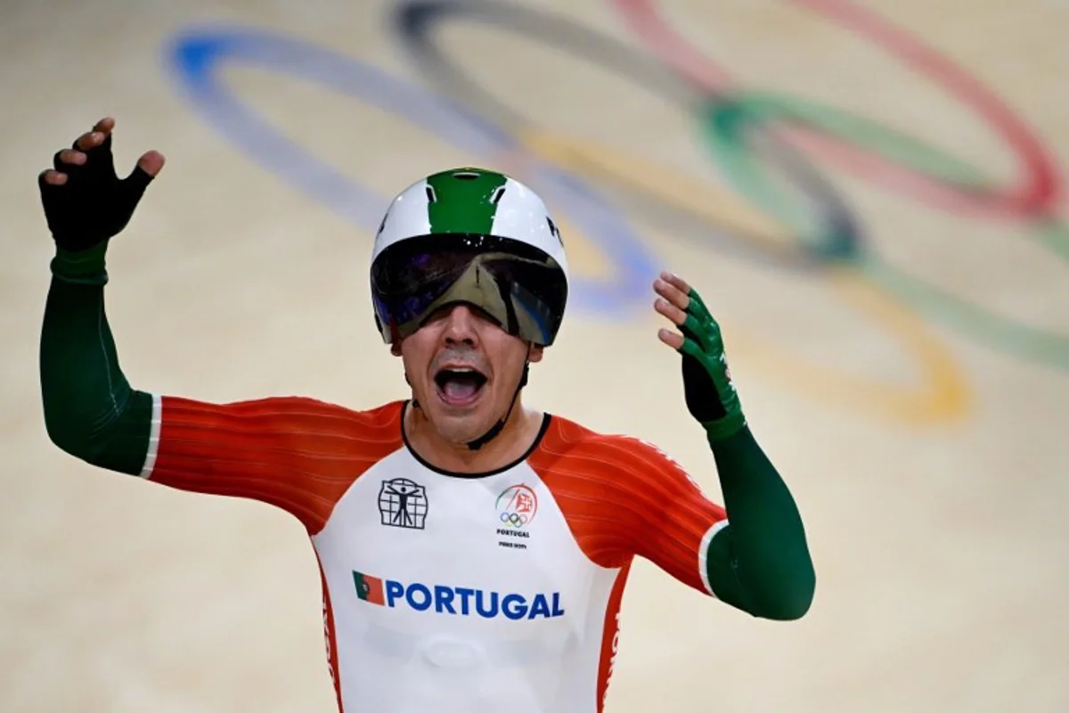 Portugal's Iuri Leitao celebrates after winning the men's track cycling madison final of the Paris 2024 Olympic Games at the Saint-Quentin-en-Yvelines National Velodrome in Montigny-le-Bretonneux, south-west of Paris, on August 10, 2024.  John MACDOUGALL / AFP