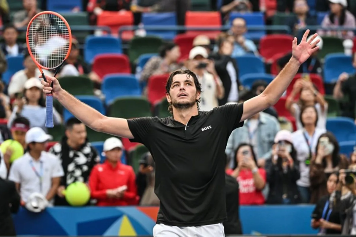 USA's Taylor Fritz celebrates after winning against Belgium's David Goffin in their men's singles match at the Shanghai Masters tennis tournament in Shanghai on October 11, 2024.  HECTOR RETAMAL / AFP