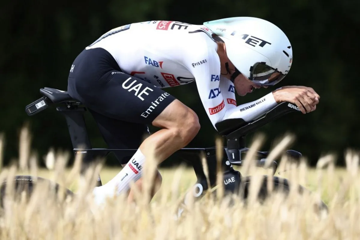 UAE Team Emirates team's Spanish rider Juan Ayuso cycles during the 7th stage of the 111th edition of the Tour de France cycling race, 25,3 km individual time trial between Nuits-Saint-Georges and Gevrey-Chambertin, on July 5, 2024.  Anne-Christine POUJOULAT / AFP