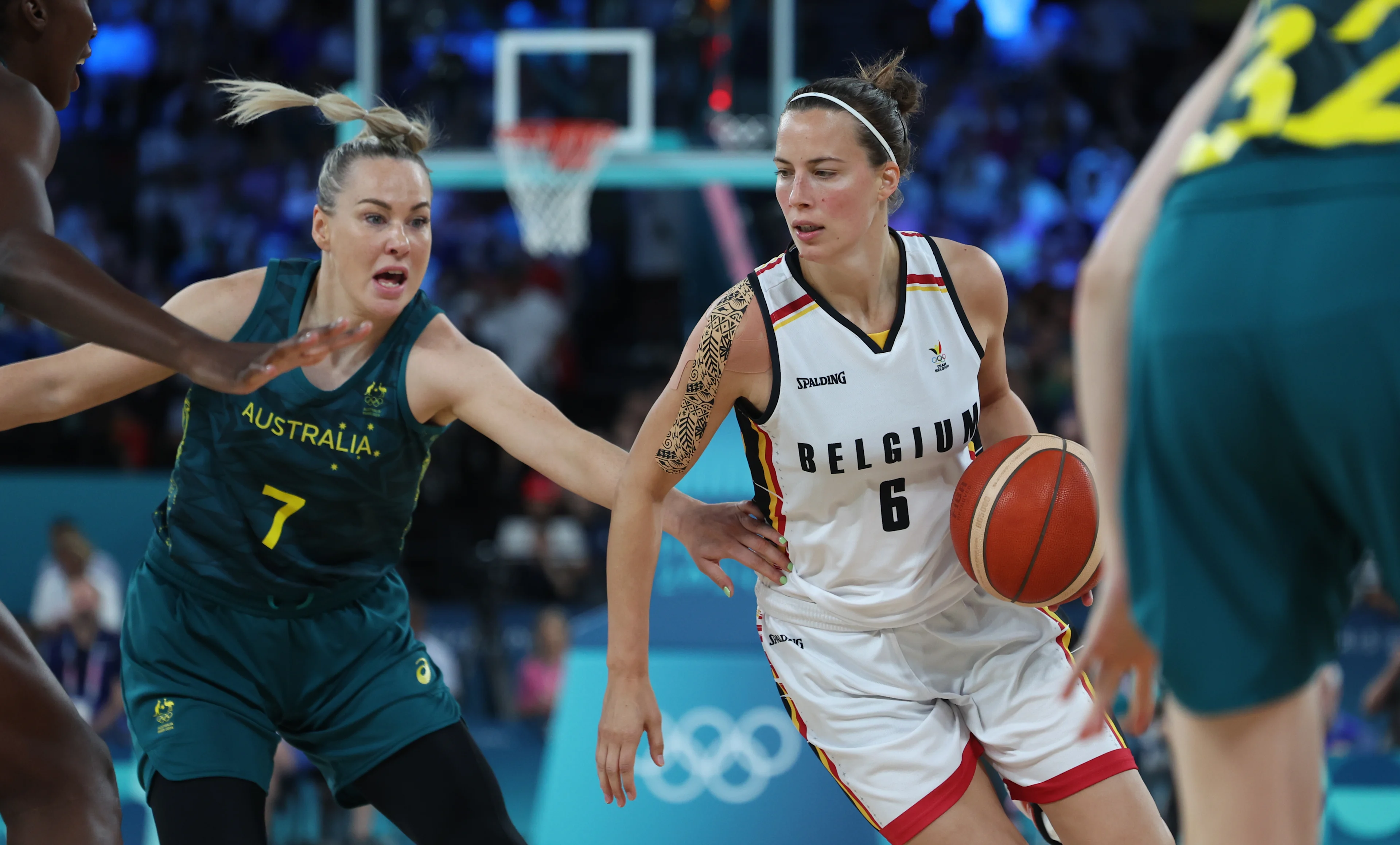 Australia's Tess Madgen and Belgium's Antonia Delaere fight for the ball during a basketball game between Australia and Belgian national team the Belgian Cats, the bronze medal game of the women's tournament at the Paris 2024 Olympic Games, on Sunday 11 August 2024 in Paris, France. The Games of the XXXIII Olympiad are taking place in Paris from 26 July to 11 August. The Belgian delegation counts 165 athletes competing in 21 sports. BELGA PHOTO VIRGINIE LEFOUR