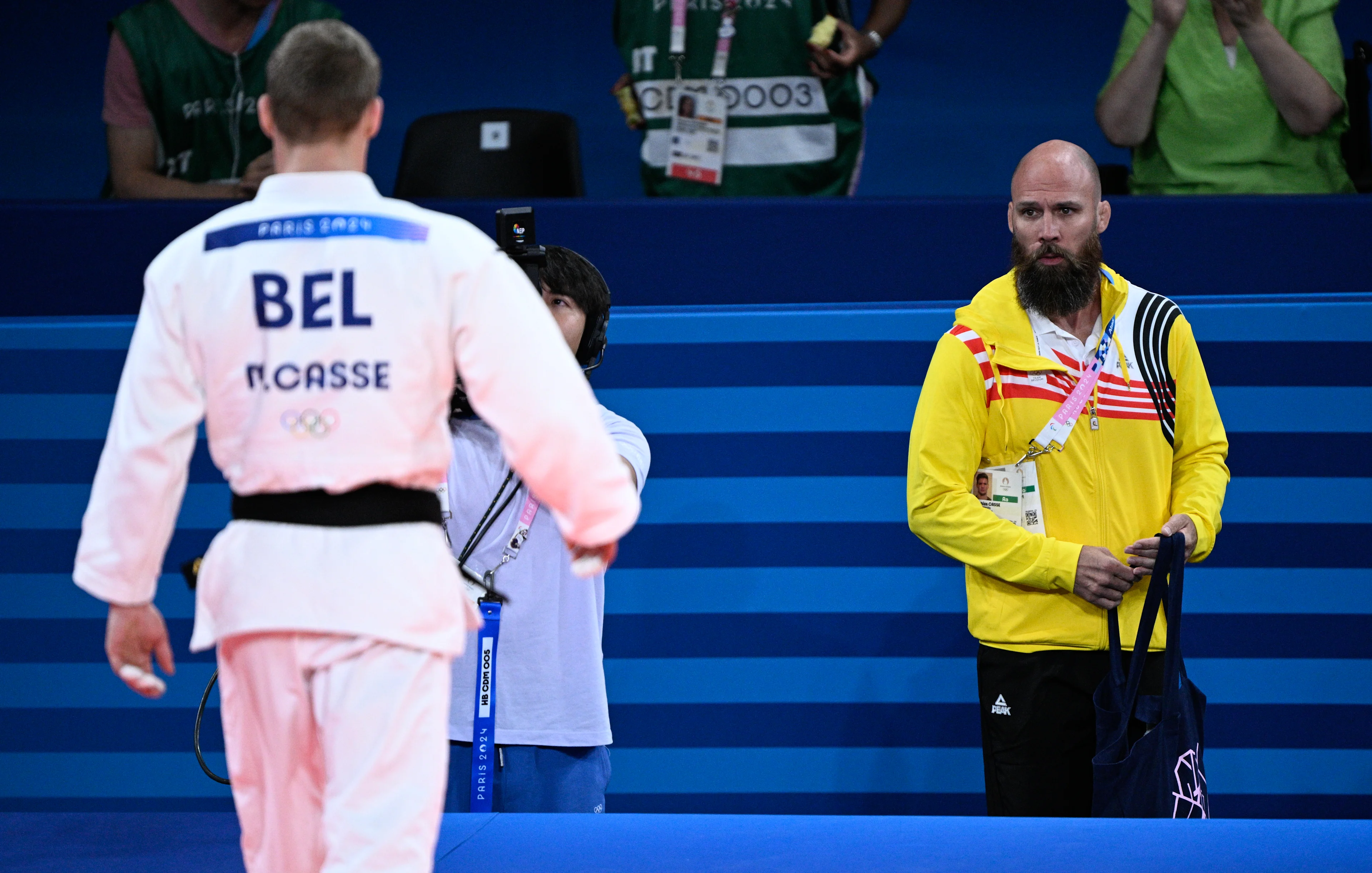 Belgian Matthias Casse celebrates with his coach Mark Van Der Ham after winning a judo bout against Hungarian Ungvari in the elimination round of 16 of the -81kg category of the men's judo competition at the Paris 2024 Olympic Games, on Tuesday 30 July 2024 in Paris, France. The Games of the XXXIII Olympiad are taking place in Paris from 26 July to 11 August. The Belgian delegation counts 165 athletes competing in 21 sports. BELGA PHOTO JASPER JACOBS