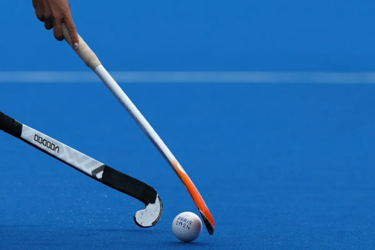 Players fight for the ball in the women's pool A field hockey match between the Netherlands and Japan during the Paris 2024 Olympic Games at the Yves-du-Manoir Stadium in Colombes on August 3, 2024. Ahmad GHARABLI / AFP