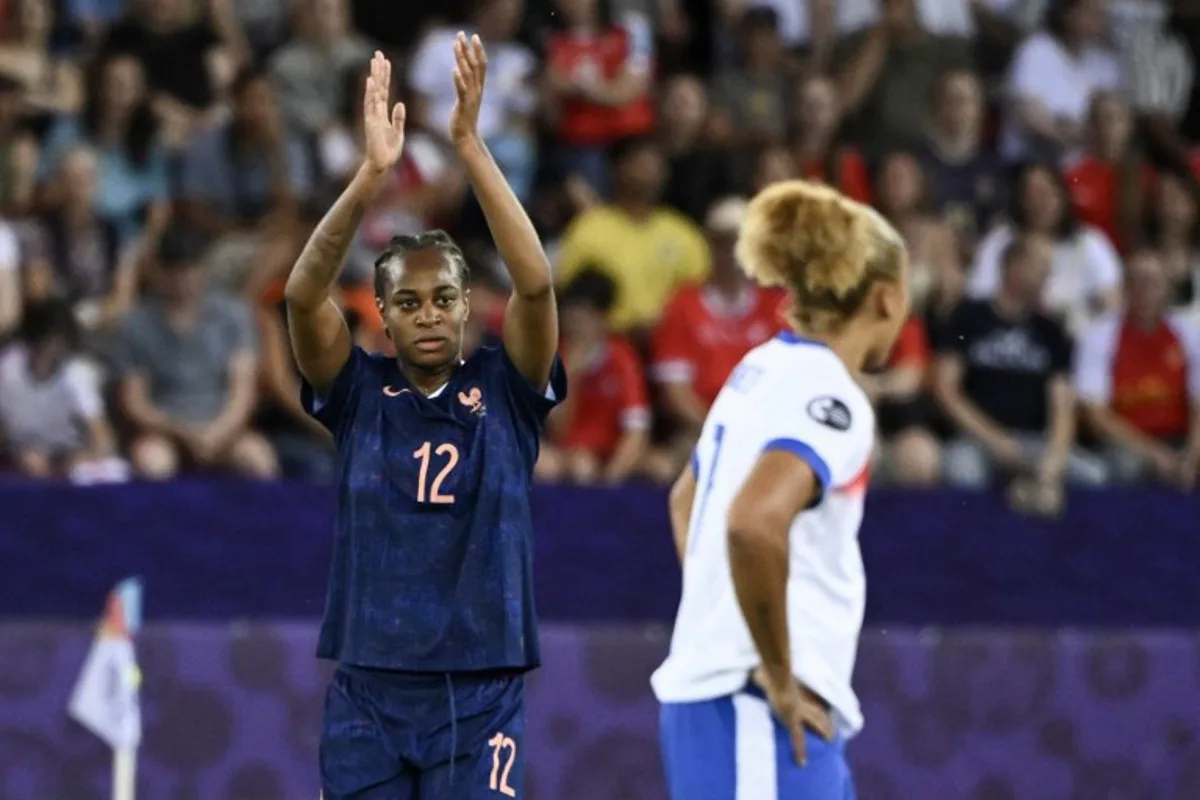 (From L) France's forward #12 Marie-Antoinette Katoto (L) celebratesafter she scored her team's first goal during the UEFA Women's Euro 2025 Group D football match between France and England at the Letzigrund Stadium in Zurich, on July 5, 2025. SEBASTIEN BOZON / AFP