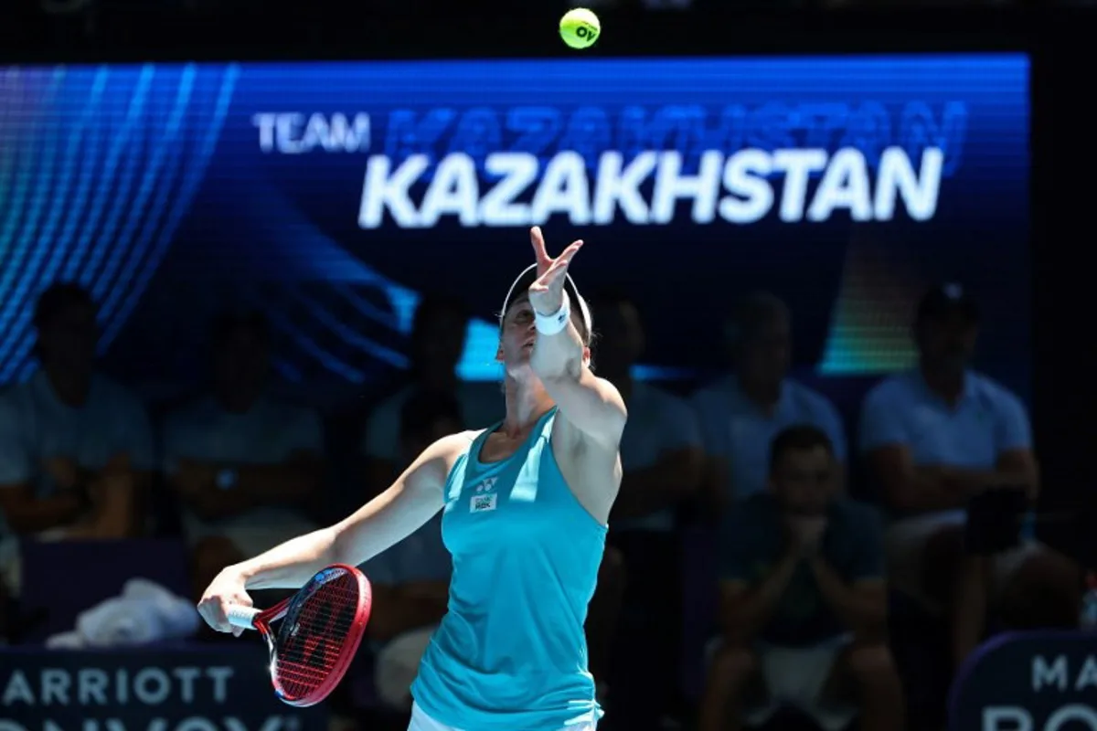 Kazakhstan's Elena Rybakina serves against Greece's Maria Sakkari during their women's singles match at the United Cup tennis tournament in Perth on December 30, 2024.  COLIN MURTY / AFP