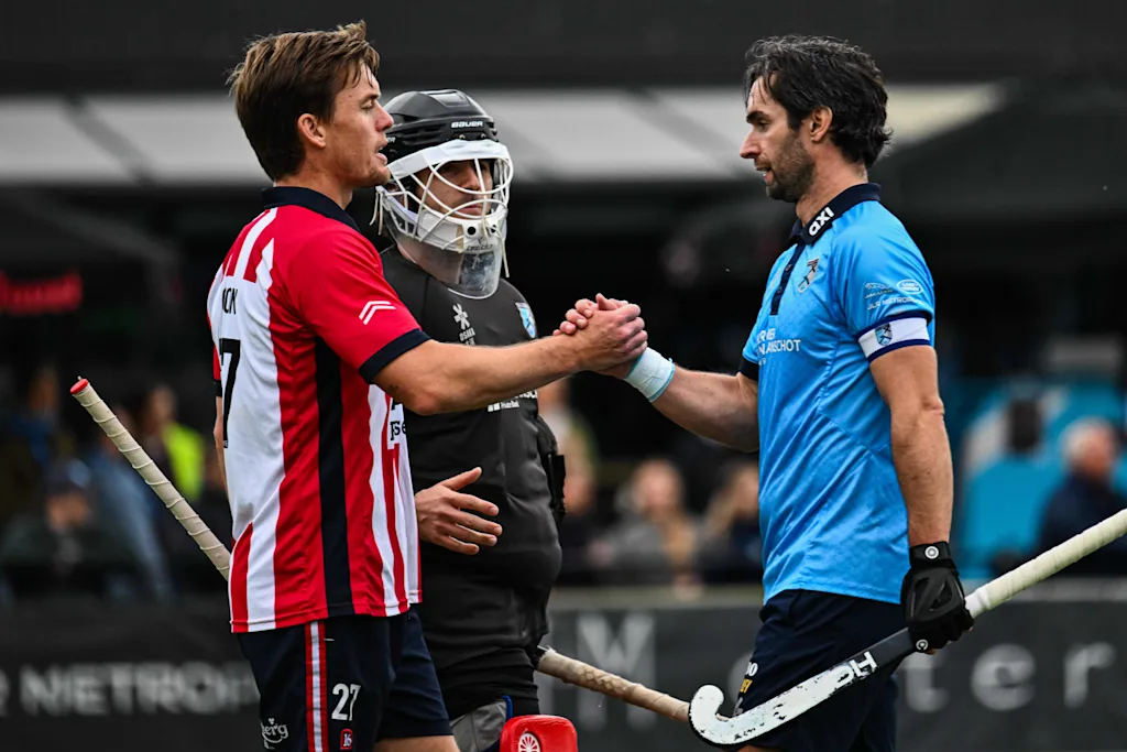 Leopold's Tom Boon and Braxgata's Loick Luypaert pictured after a hockey game between Braxgata and Leopold, Sunday 18 October 2026 in Boom, on day 6 of the Belgian first division hockey championship. BELGA PHOTO EMILE WINDAL