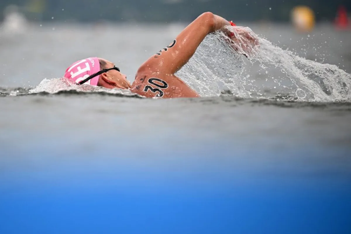 Belgium's Logan Vanhuys competes in the men's 5km open water swimming event during the World Aquatics Championships in Fukuoka on July 18, 2023.  Philip FONG / AFP