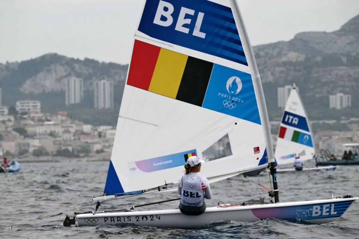 Belgium's Emma Plasschaert prepares for the medal race of the women's ILCA 6 single-handed dinghy event during the Paris 2024 Olympic Games sailing competition at the Roucas-Blanc Marina in Marseille on August 7, 2024.   Christophe SIMON / AFP