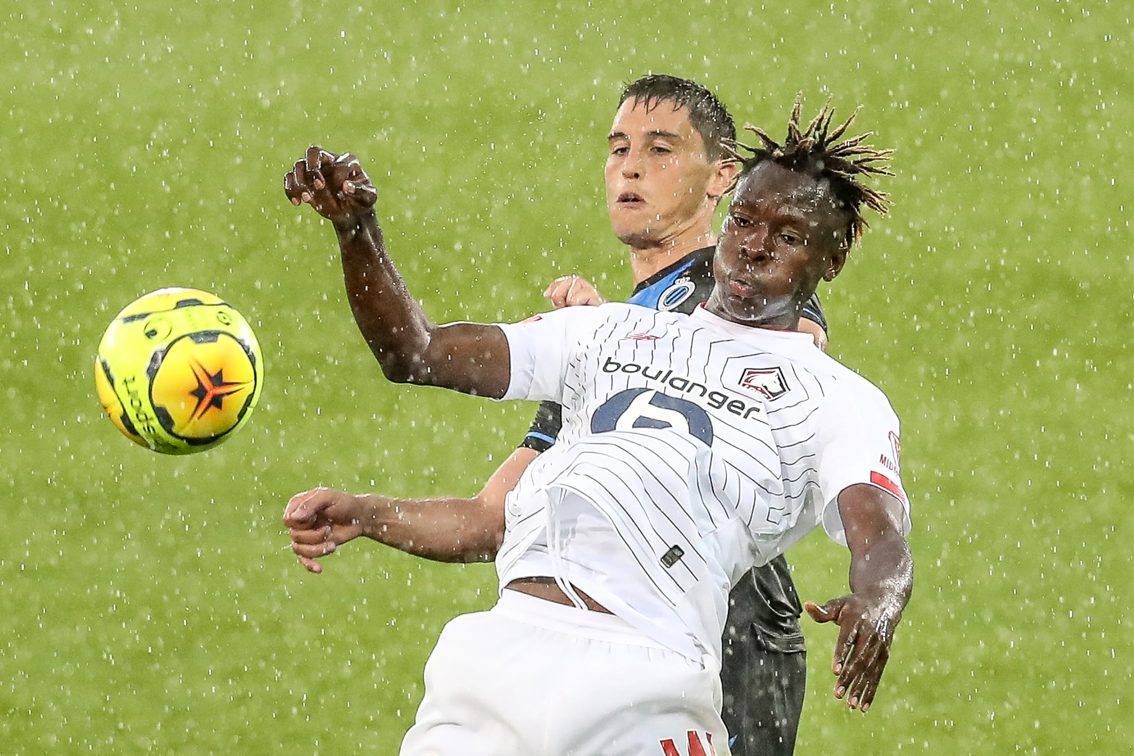 Club's Federico Ricca and Lille's Usman Simbakoli fight for the ball during a friendly soccer game between Club Brugge KV and French team Lille OSC, during the 'Brugse Metten', Saturday 25 July 2020 in Brugge, in preparation of the upcoming 2020-2021 season. BELGA PHOTO BRUNO FAHY