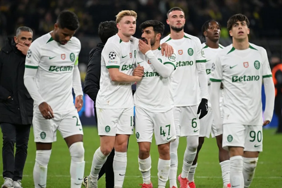 Sporting players react after the UEFA Champions League second-leg knockout round play-off football match BVB Borussia Dortmund vs Sporting CP at the Signal Iduna stadium in Dortmund, western Germany, on February 19, 2025.  UWE KRAFT / AFP