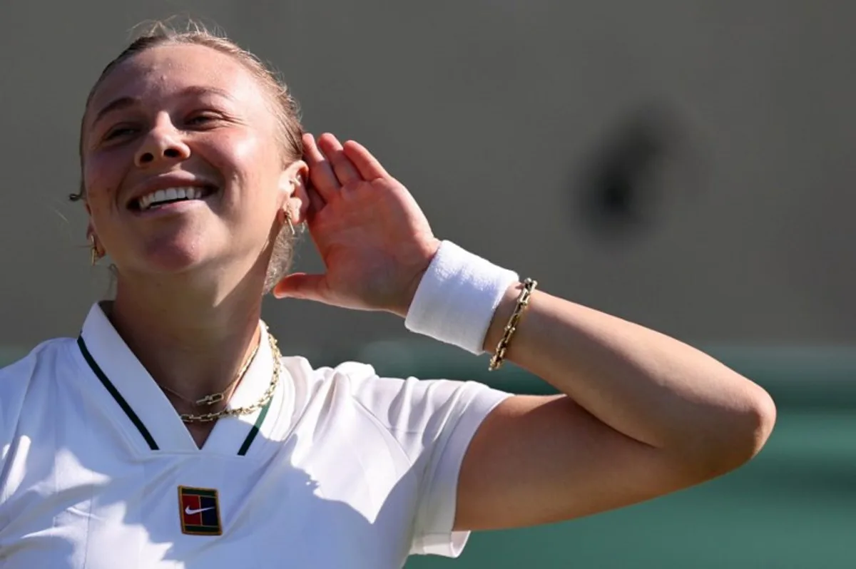 US player Amanda Anisimova celebrates beating US player Sofia Kenin during their women's singles second round tennis match on the fourth day of the 2026 Wimbledon Championships at The All England Lawn Tennis and Croquet Club in Wimbledon, southwest London, on July 2, 2026. Henry Nicholls / AFP