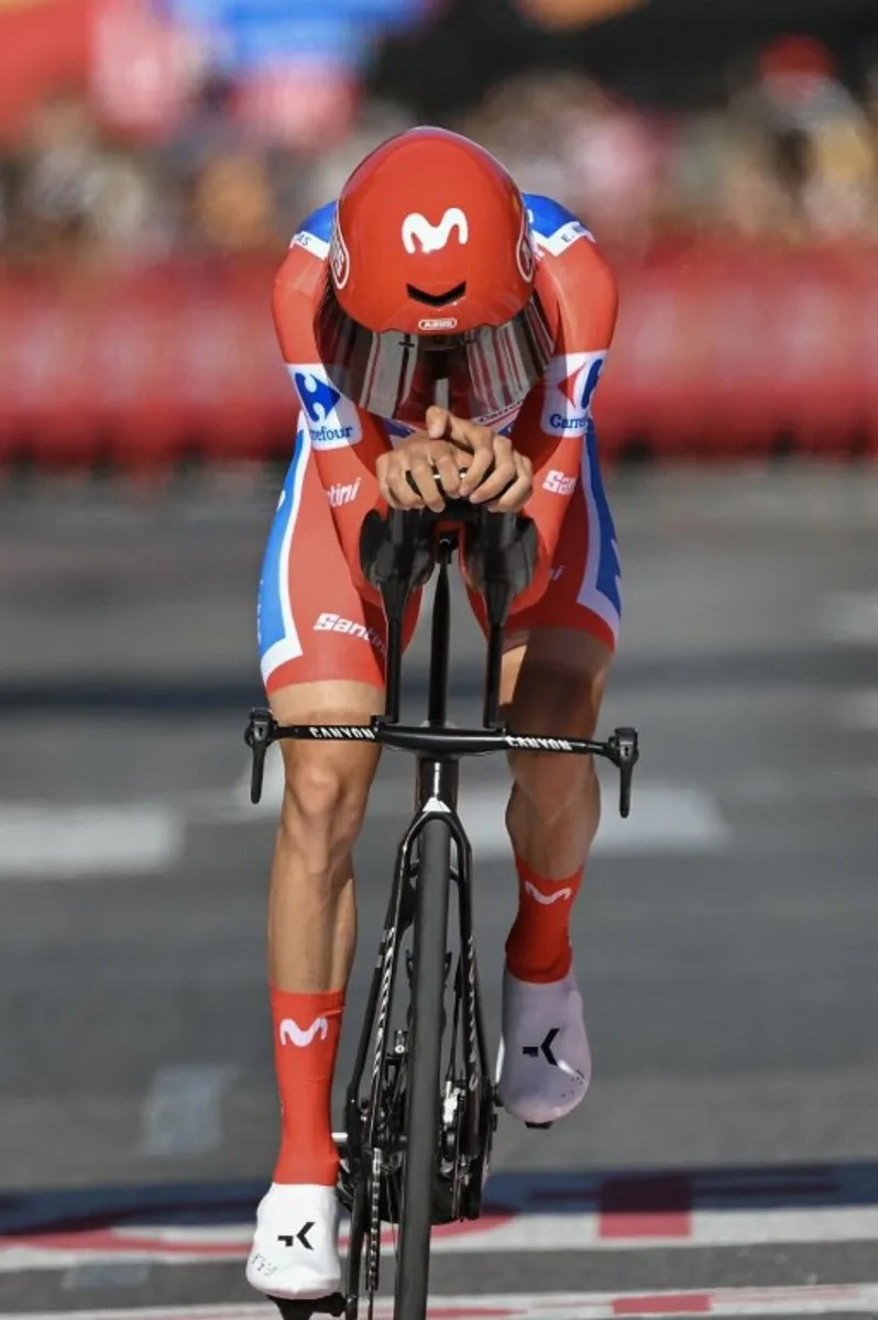 Overall race leader Team Movistar's Spanish rider Enric Mas crosses the finish line of the 18th stage of the Vuelta a Espana 2026 cycling tour, a 32,1 km individual time-trial race between El Puerto de Santa Maria and Jerez de la Frontera, on September 10, 2026.   JORGE GUERRERO / AFP