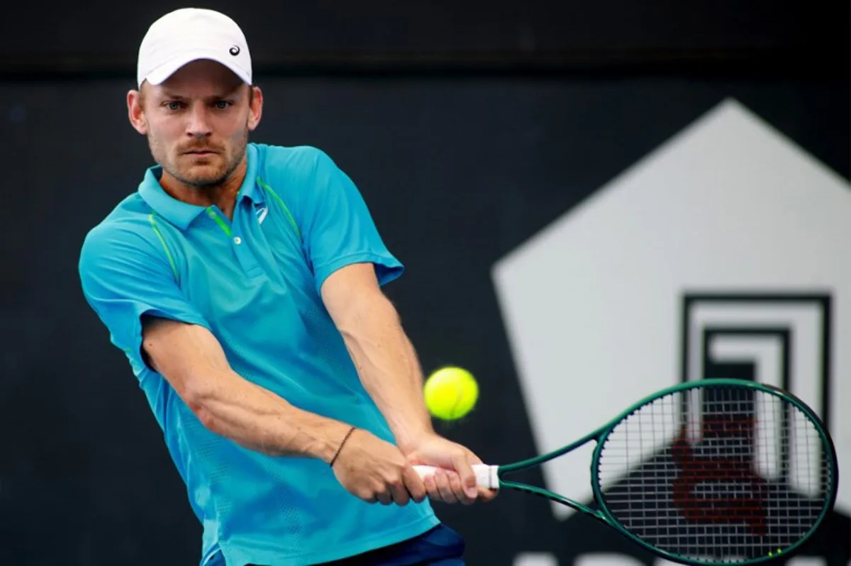 This handout photo released by Tennis Australia on January 7, 2025, shows Belgium's David Goffin hits a return against Australia's Rinky Hijikata during their men's singles match at the Adelaide International tennis tournament in Adelaide.  Kelly BARNES / TENNIS AUSTRALIA / AFP