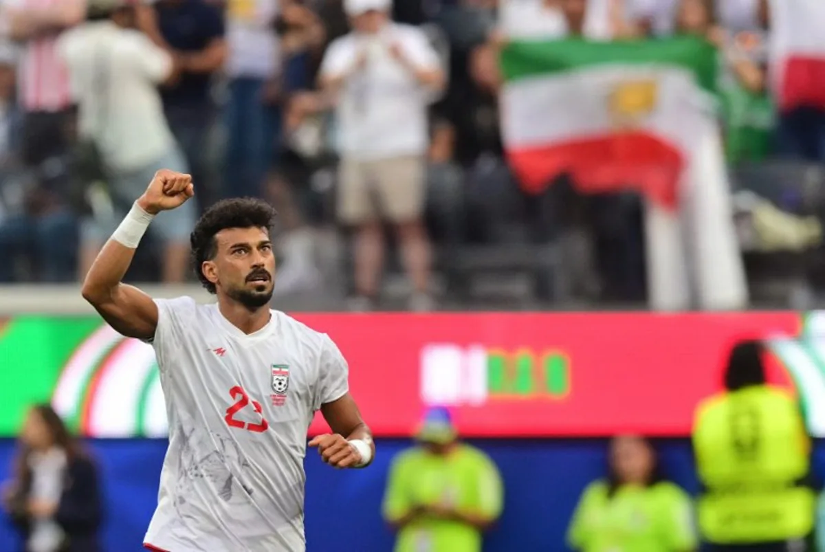 Iran's defender #23 Ramin Rezaeian celebrates scoring his team's first goal during the 2026 World Cup Group G football match between Iran and New Zealand at Los Angeles Stadium in Inglewood on June 15, 2026.   Frederic J. Brown / AFP
