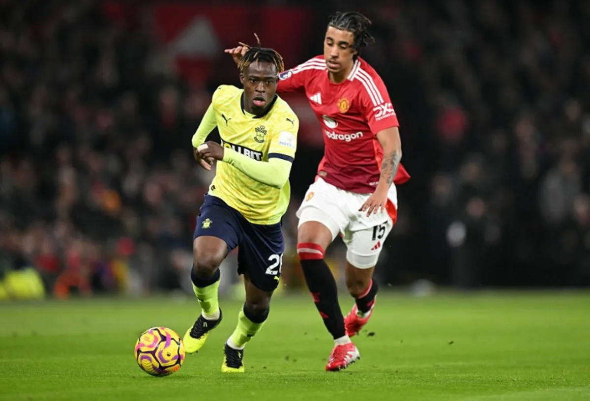 Manchester United's French defender #15 Leny Yoro (R) vies with Southampton's Ghanaian midfielder #20 Kamaldeen Sulemana during the English Premier League football match between Manchester United and Southampton at Old Trafford in Manchester, north west England, on January 16, 2025.  Oli SCARFF / AFP