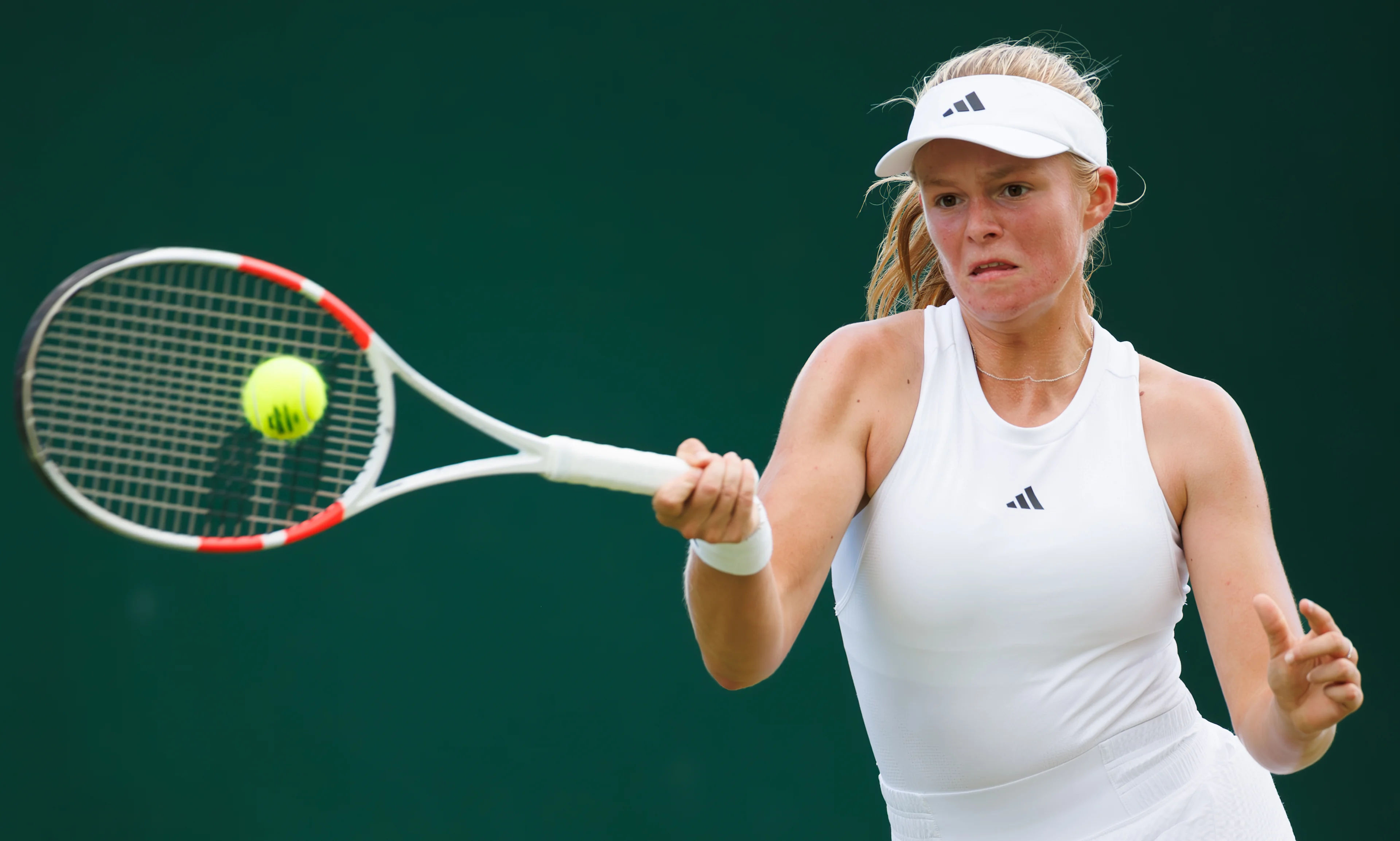 Belgian Jeline Vandromme pictured in action during a tennis match between Belgian Vandromme and Korean Jang, in round 1 of the girls singles of the 2024 Wimbledon grand slam tournament at the All England Tennis Club, in south-west London, Britain, Sunday 07 July 2024. BELGA PHOTO BENOIT DOPPAGNE