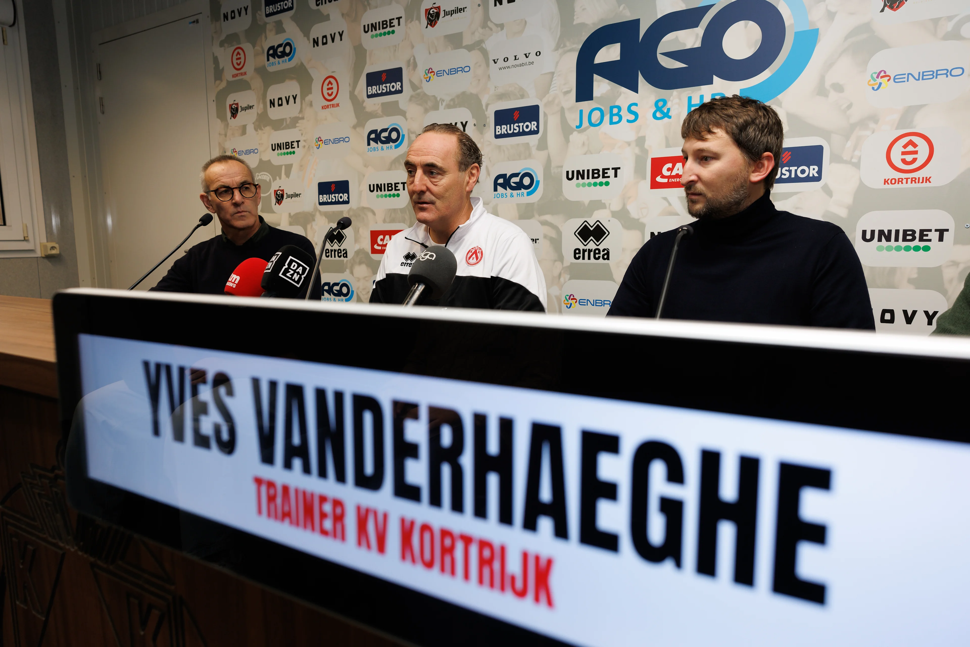 Kortrijk's sports manager Rik Foulon, Kortrijk's new head coach Yves Vanderhaeghe and Kortrijk's CEO Sports Pieter Eecloo pictured during a press conference of Belgian first division soccer team KV Kortrijk to present its new coach, Wednesday 18 December 2024 in Kortrijk. Belgian trainer Vanderhaeghe signed up for his third stint at the club, after Icelandic Alexandersson was discharged yesterday. BELGA PHOTO KURT DESPLENTER